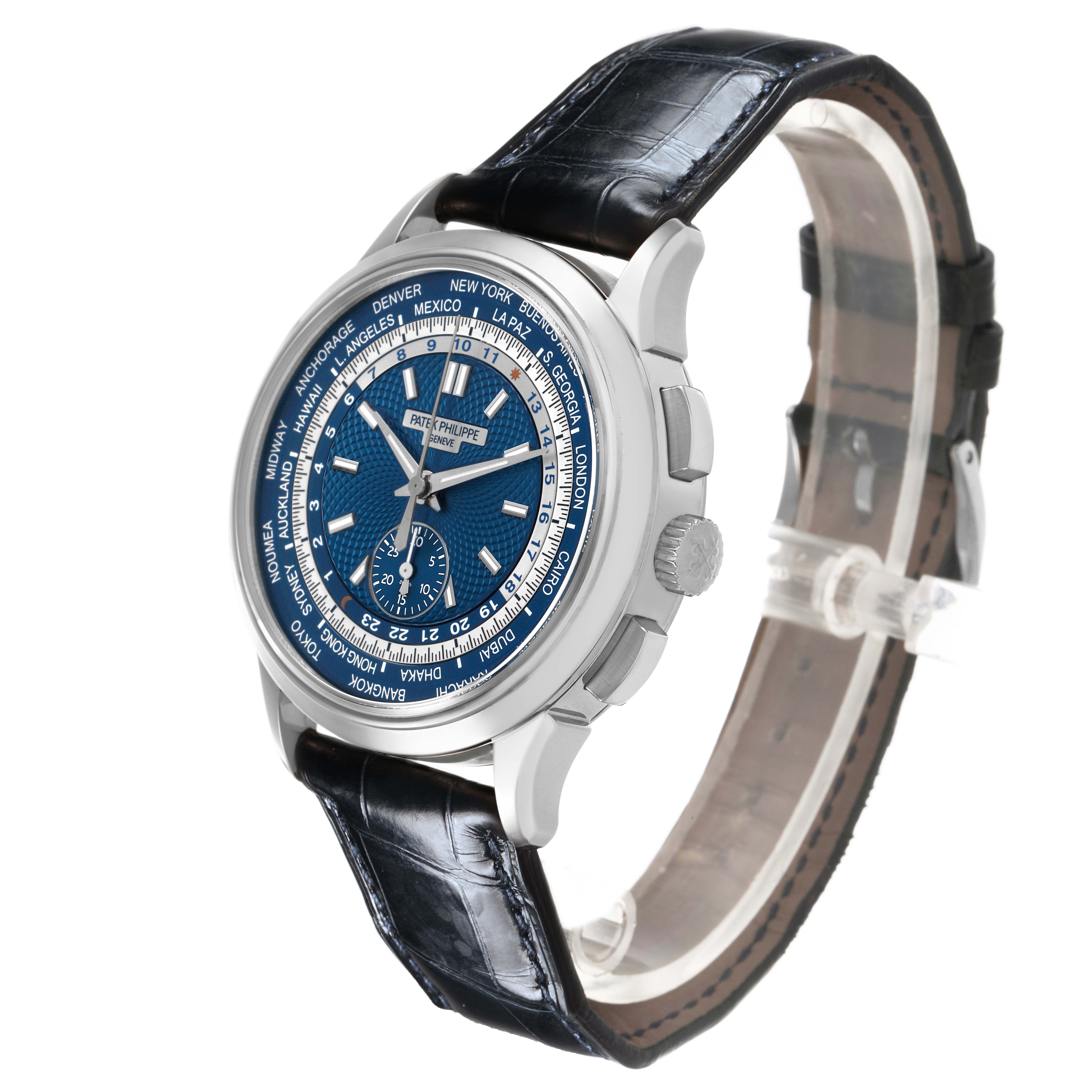 The Complications model by Patek Philippe is shown at a three-quarter angle, highlighting the dial, case, crown, and leather strap.