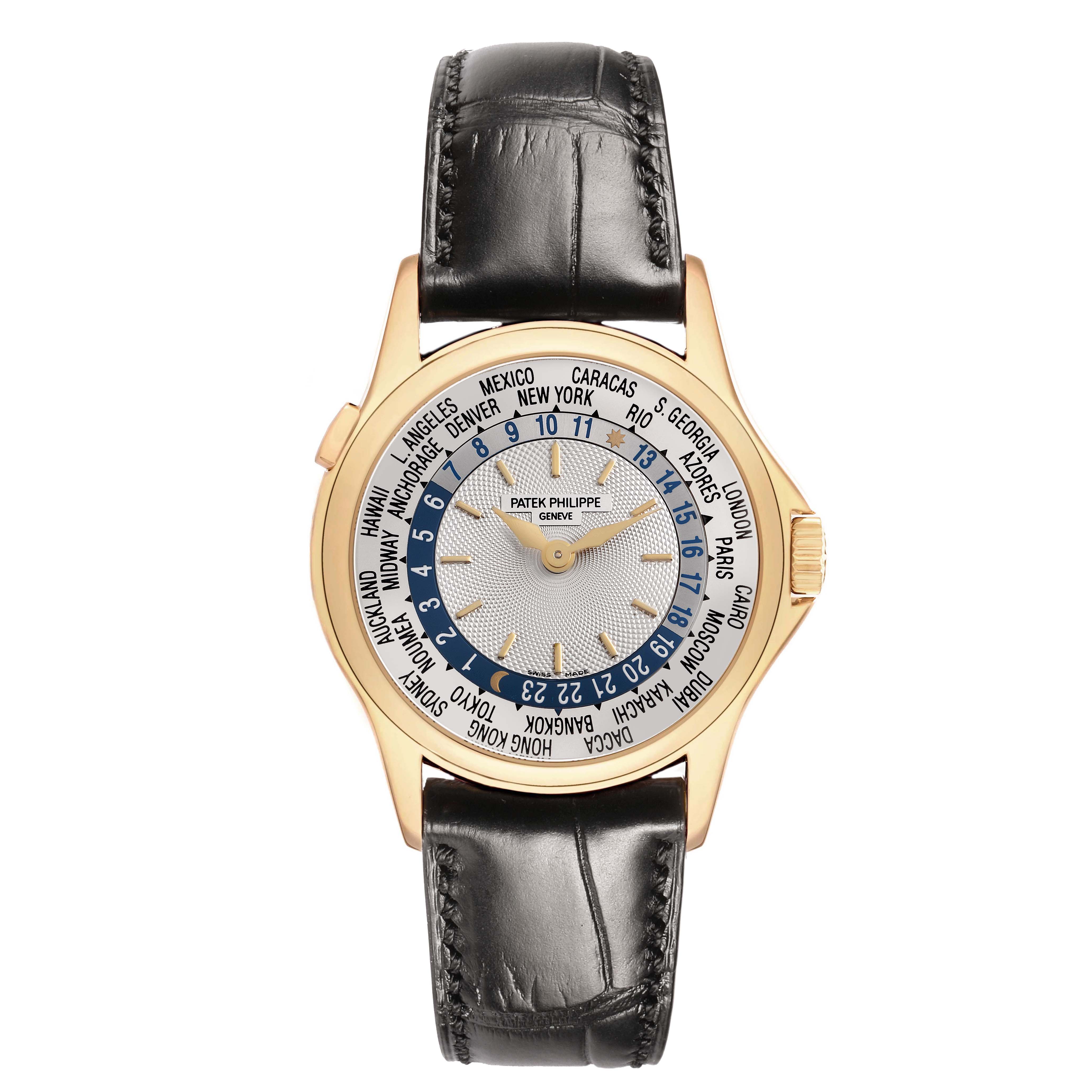 The Patek Philippe Complications 5110J-001 Men's Yellow Gold Silver Dial watch is shown from a top angle, highlighting the face, world time cities, and leather strap.