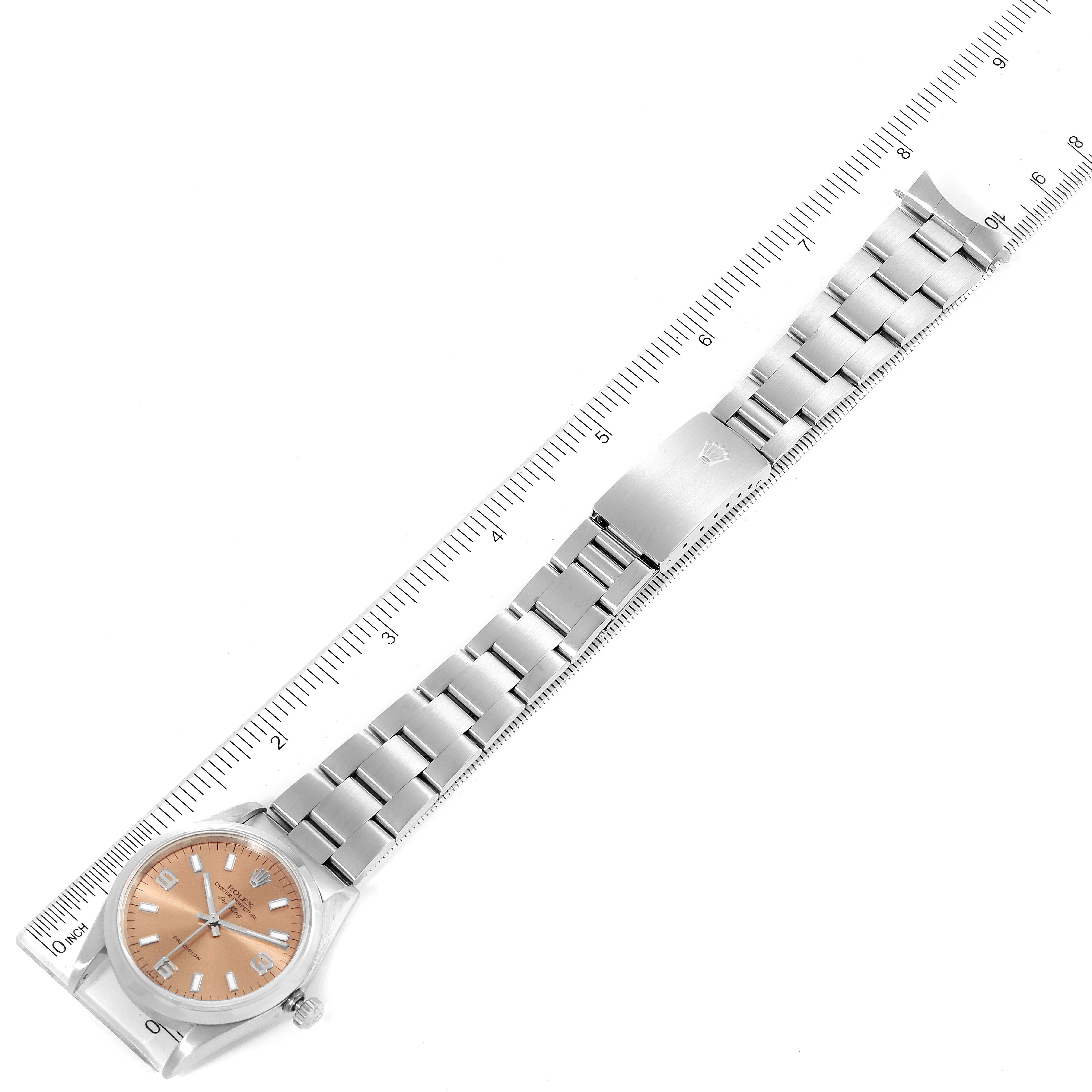 The image shows a top-down view of a Rolex Air-King 14000 Men's Stainless Steel Pink Dial 14000 Men's Stainless Steel Pink Dial watch, including its dial, bracelet, and clasp.