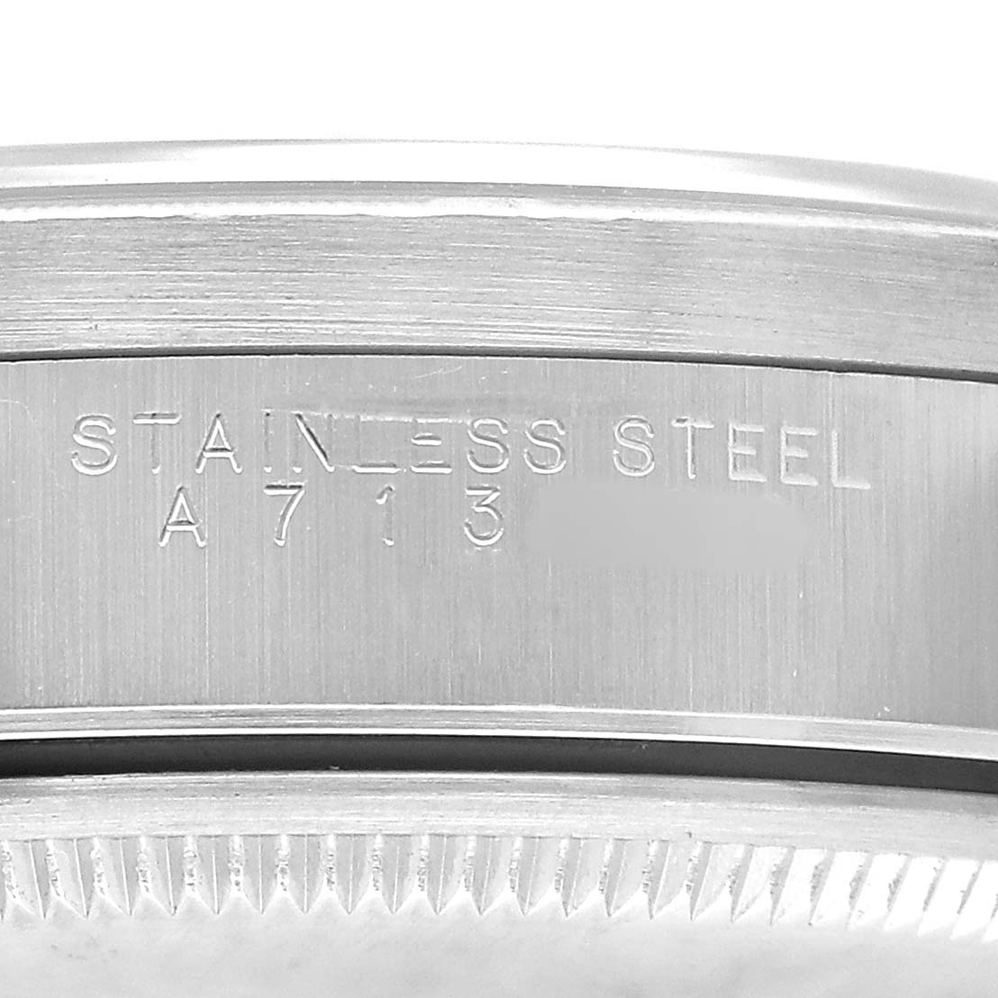 The image shows the side profile of the Rolex Air-King 14010 Men's Stainless Steel Blue Dial watch, highlighting its stainless steel case with engraved details.