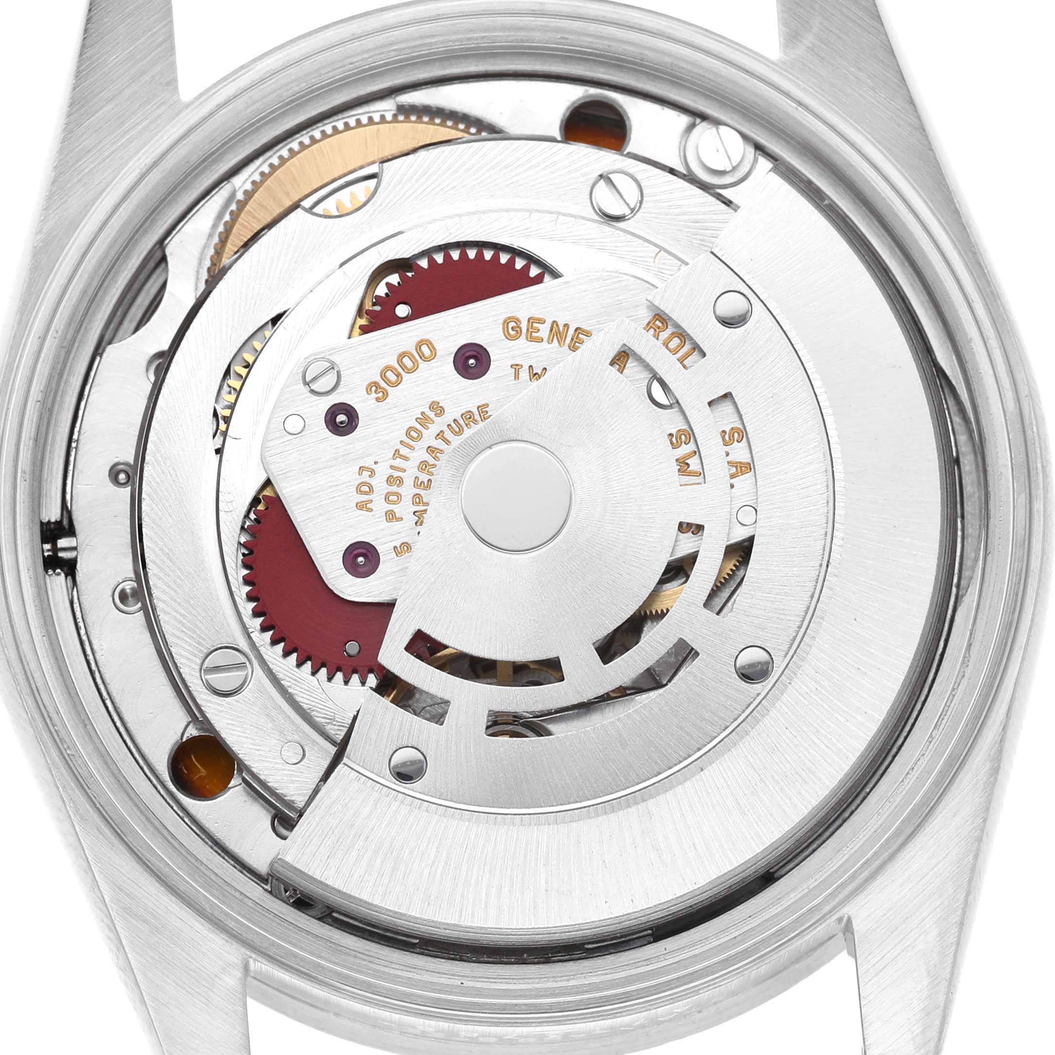 The image shows a close-up of the Rolex Air-King 14010 Men's Stainless Steel Blue Dial watch's movement from the back, highlighting its intricate mechanisms.