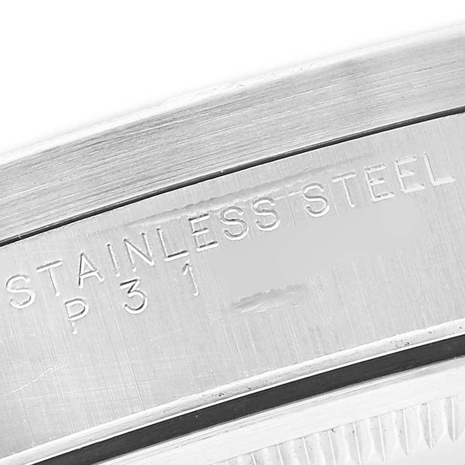 The image shows a close-up of the case back of a Rolex Air-King 14010 Men's Stainless Steel Blue Dial, highlighting the "STAINLESS STEEL" engraving.