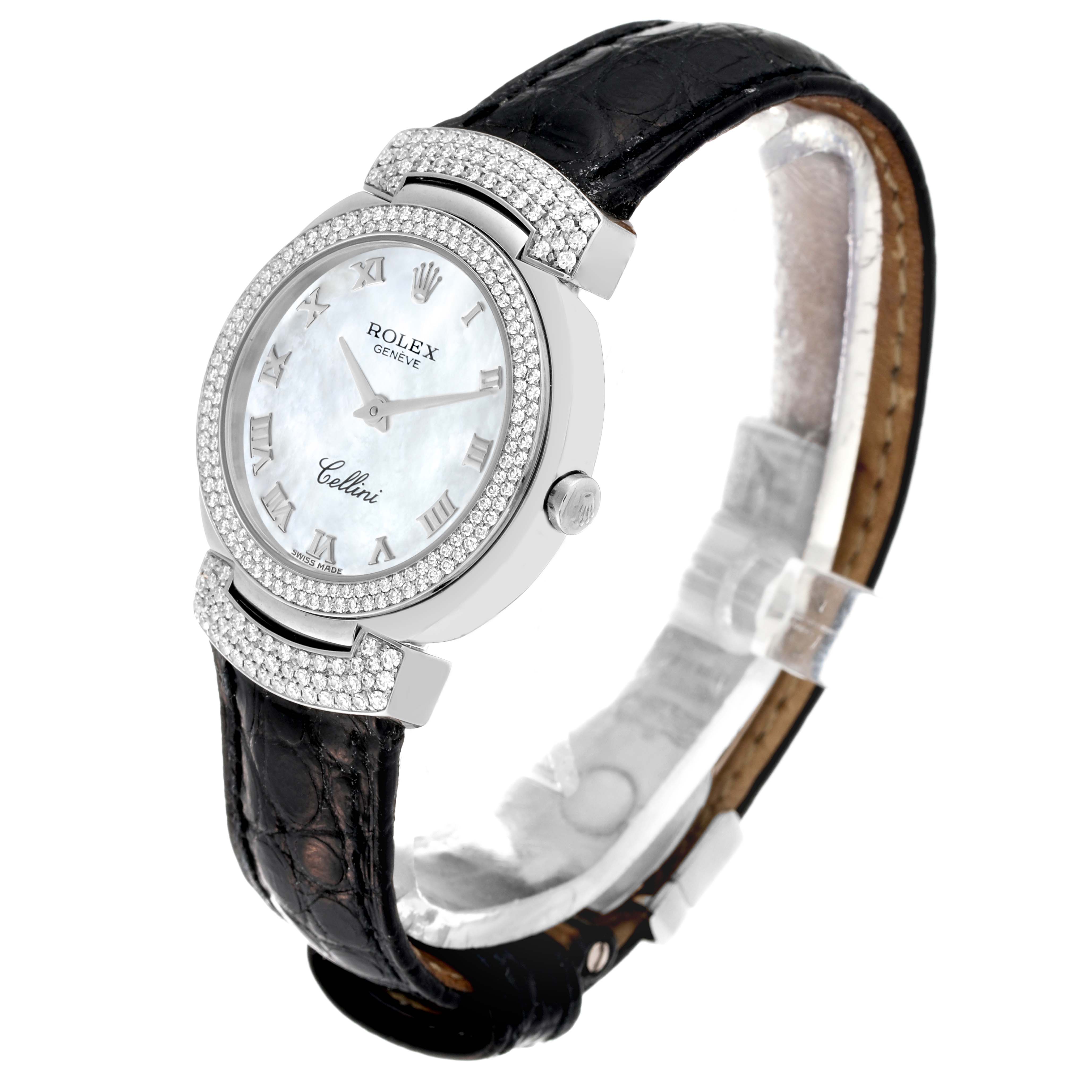 The Rolex Cellini 6673 Women's White Gold Mother of Pearl Dial 6673 Women's White Gold Mother of Pearl Dial watch is shown at an angled side view, displaying its face, bezel, crown, and leather strap.