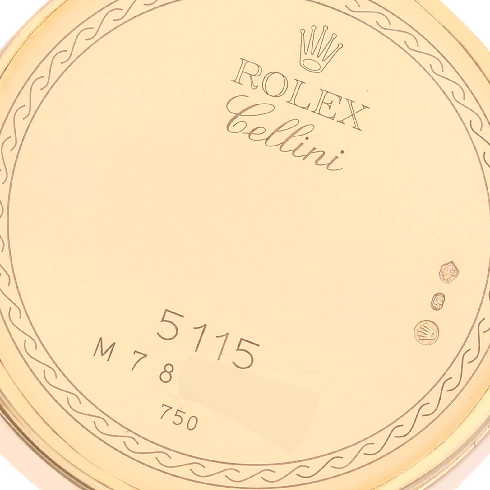 This image shows the back case of a Rolex Cellini 5115 Men's Yellow Gold Champagne Dial 5115 Men's Yellow Gold Champagne Dial watch with model number 5115, displaying engravings and hallmarks.