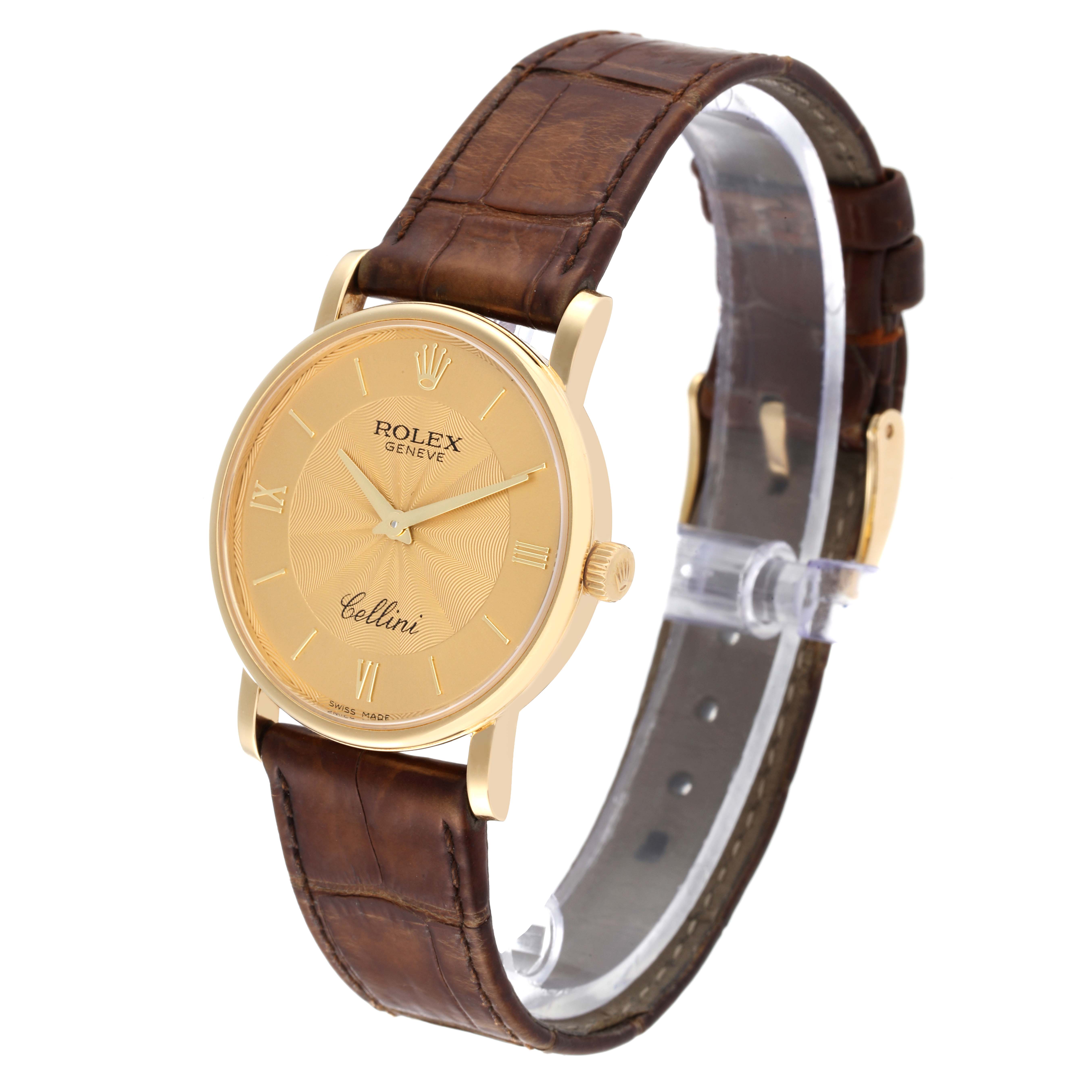 The Rolex Cellini 5115 Men's Yellow Gold Champagne Dial 5115 Men's Yellow Gold Champagne Dial watch is shown at an oblique angle, displaying the face, strap, and crown.