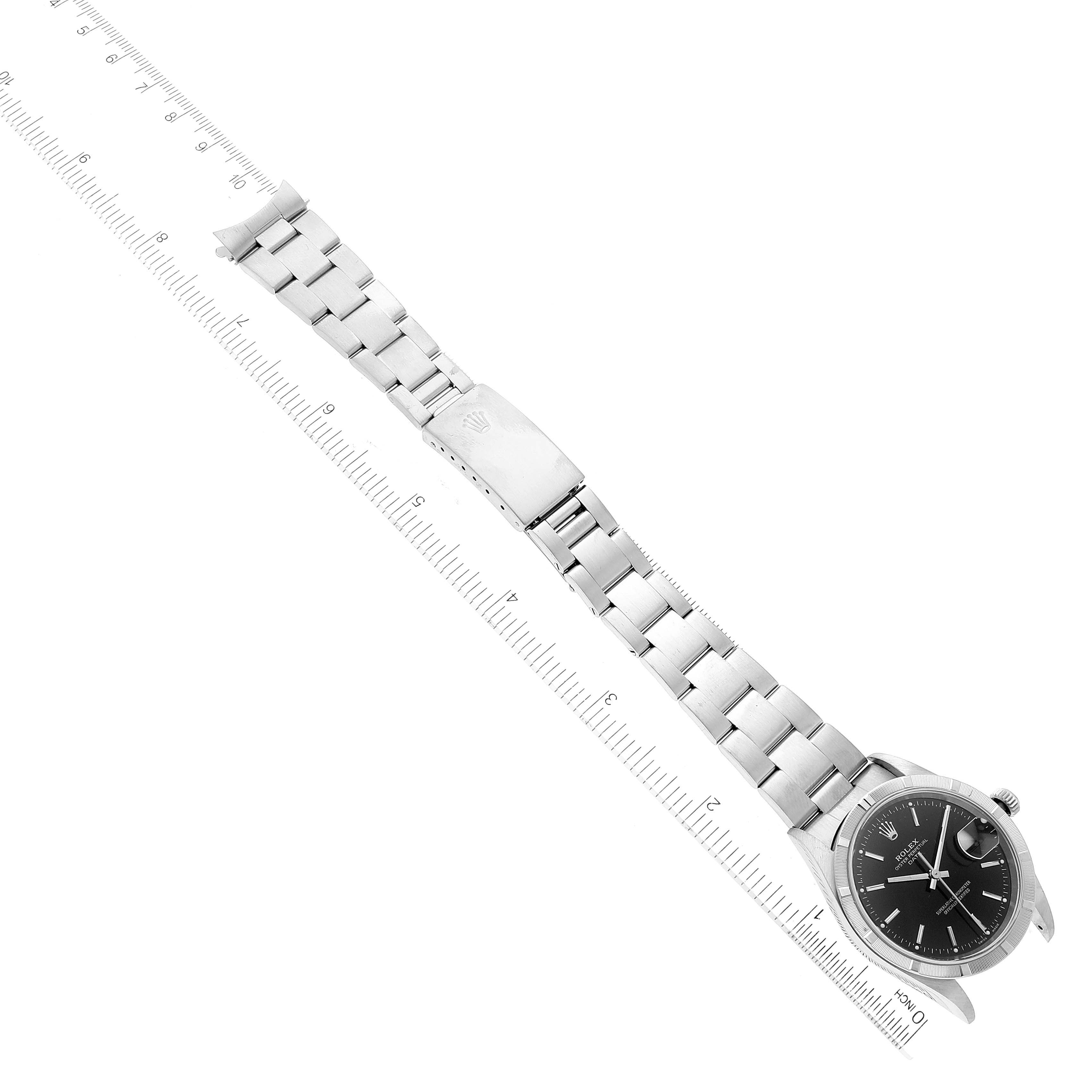 The image shows a top-down view of a Rolex Date 15210 Men's Stainless Steel Black Dial 15210 Men's Stainless Steel Black Dial model watch, displaying the face, bracelet, and clasp.