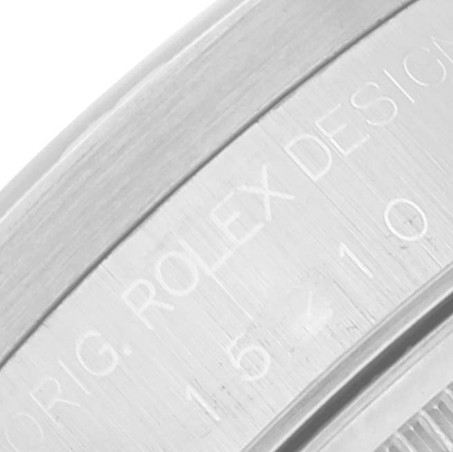 The image shows a close-up of an engraved case back or bezel of a Rolex Date 15210 Men's Stainless Steel Pink Dial 15210 Men's Stainless Steel Pink Dial model watch.