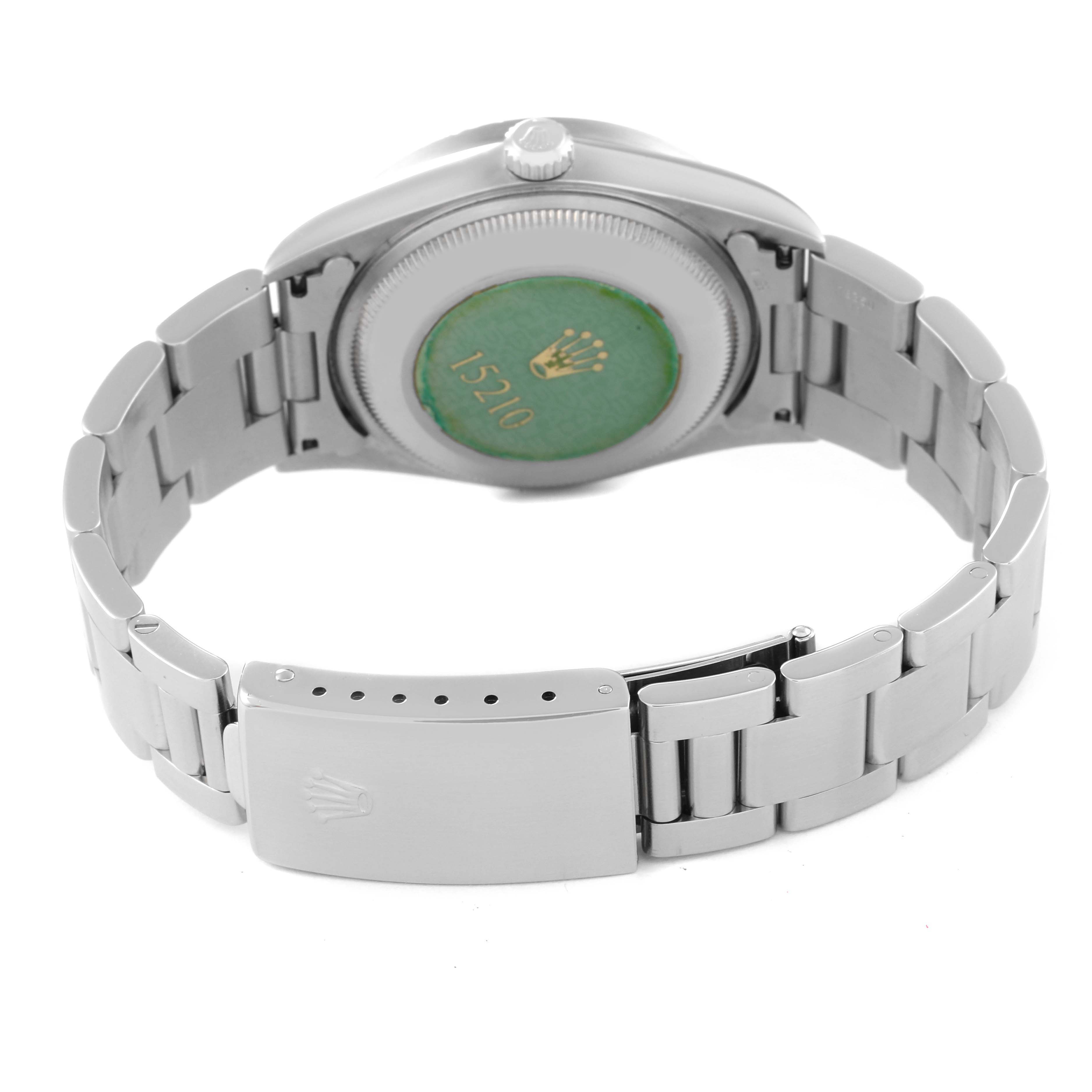 This image shows the Rolex Date 15210 Men's Stainless Steel Pink Dial 15210 Men's Stainless Steel Pink Dial model watch from the back, highlighting the case back, bracelet, and clasp.