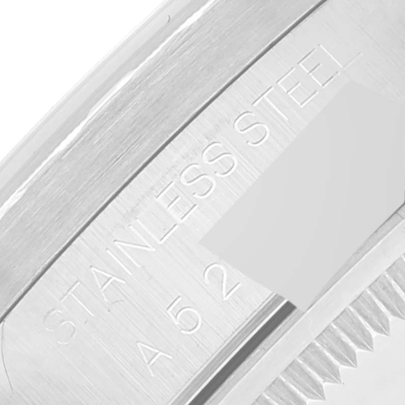 This is a close-up angle of the case back of the Rolex Date 15210 Men's Stainless Steel Pink Dial 15210 Men's Stainless Steel Pink Dial, showing the "STAINLESS STEEL" engraving.