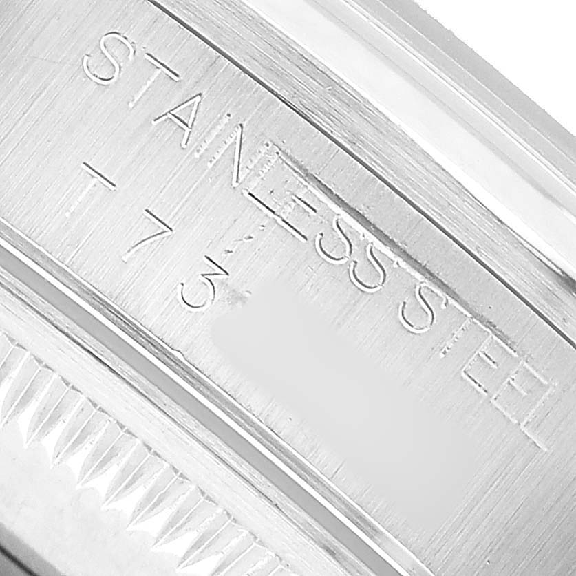 This close-up image shows the side of the Rolex Date 15200 Men's Stainless Steel Silver Dial model watch with "STAINLESS STEEL" engraving.