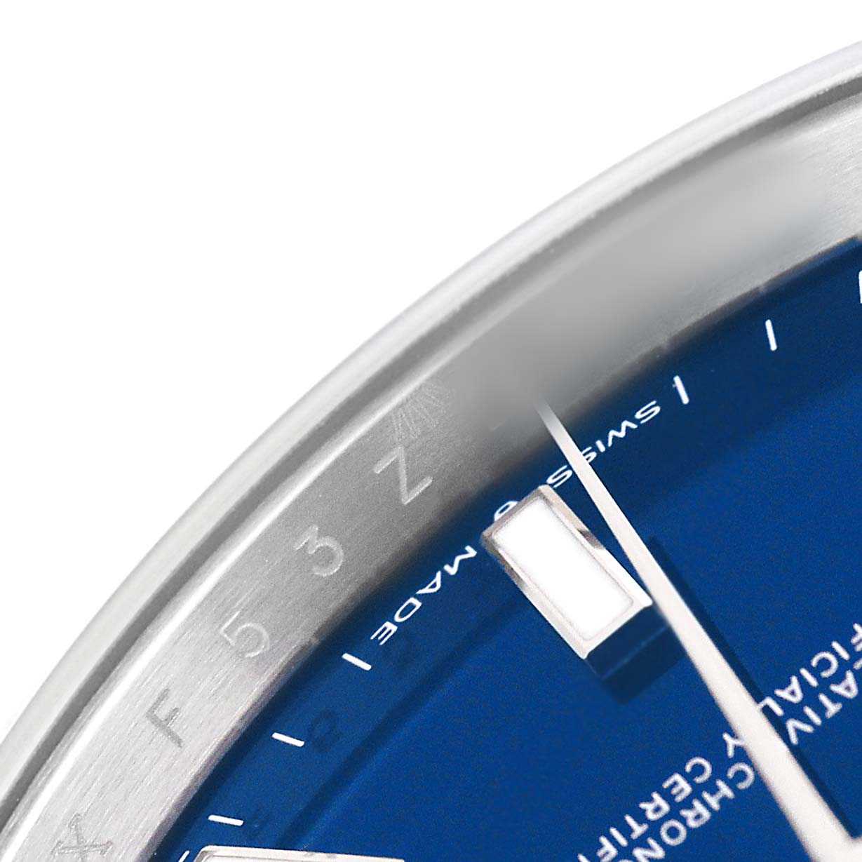 The image shows a close-up of the Rolex Datejust 41 126300 Men's Stainless Steel Blue Dial's blue dial, focusing on the edge, hour marker, and part of the rehaut.