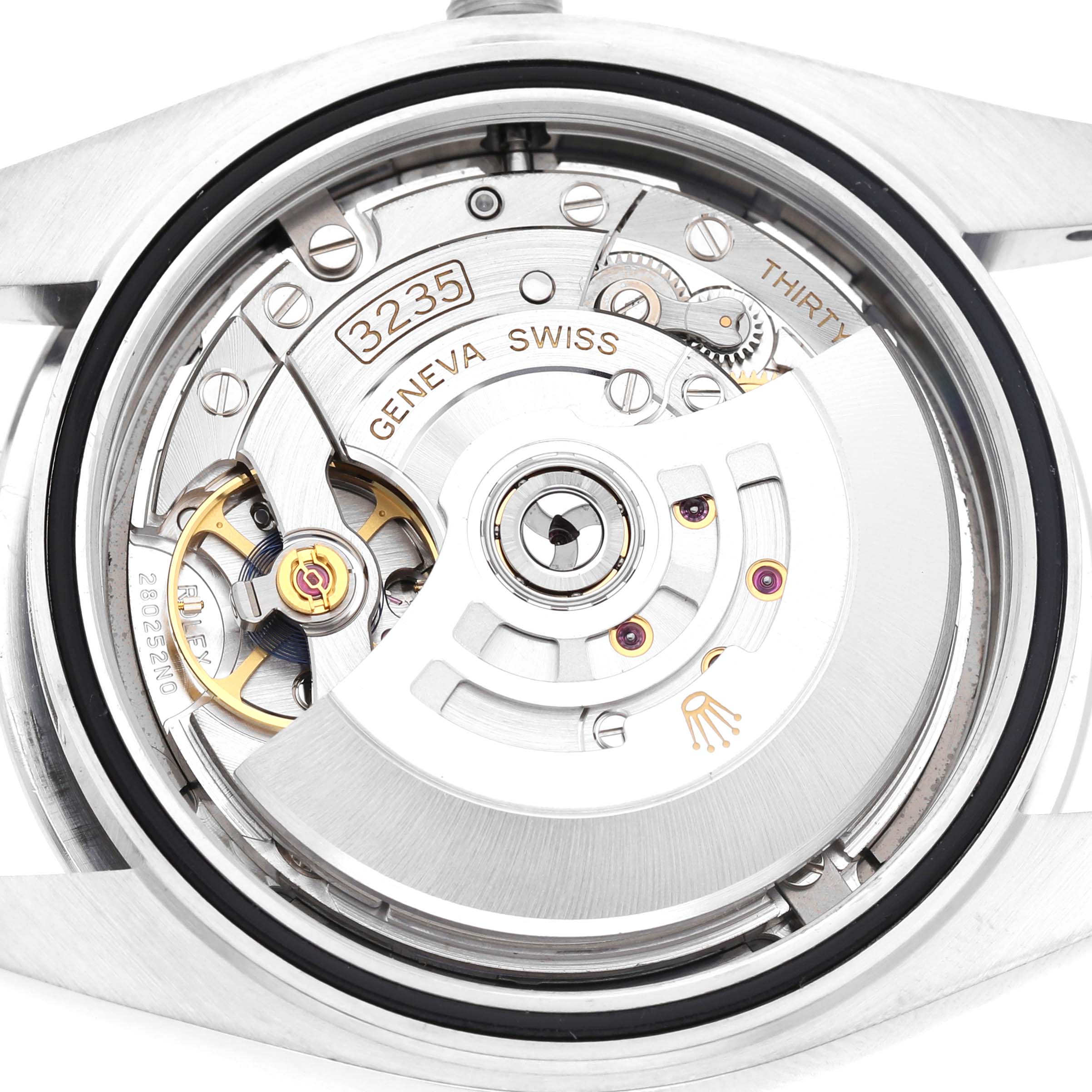 The image shows the movement of a Rolex Datejust 126300 Men's Stainless Steel Grey Dial from the back, highlighting the rotor and intricate mechanics.