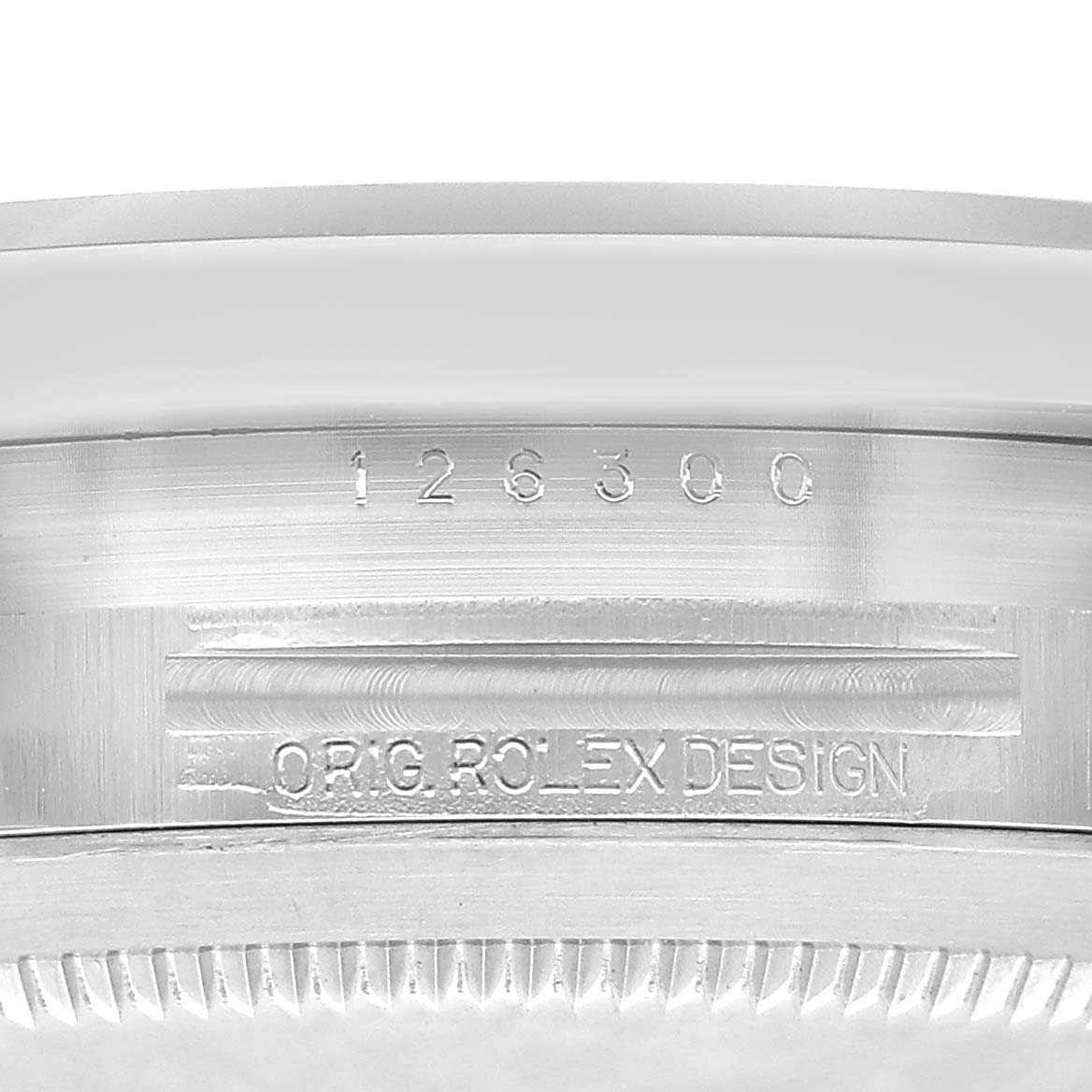The image shows the side view of a Rolex Datejust 126300 Men's Stainless Steel Grey Dial, highlighting its engraved model number and "ORIG. ROLEX DESIGN" text.