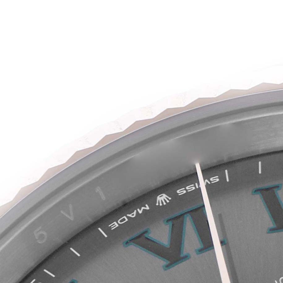 The image shows a close-up of the Rolex Datejust 41 126331 Men's Stainless Steel Grey Dial dial and bezel, highlighting the Roman numerals and "SWISS MADE" text.