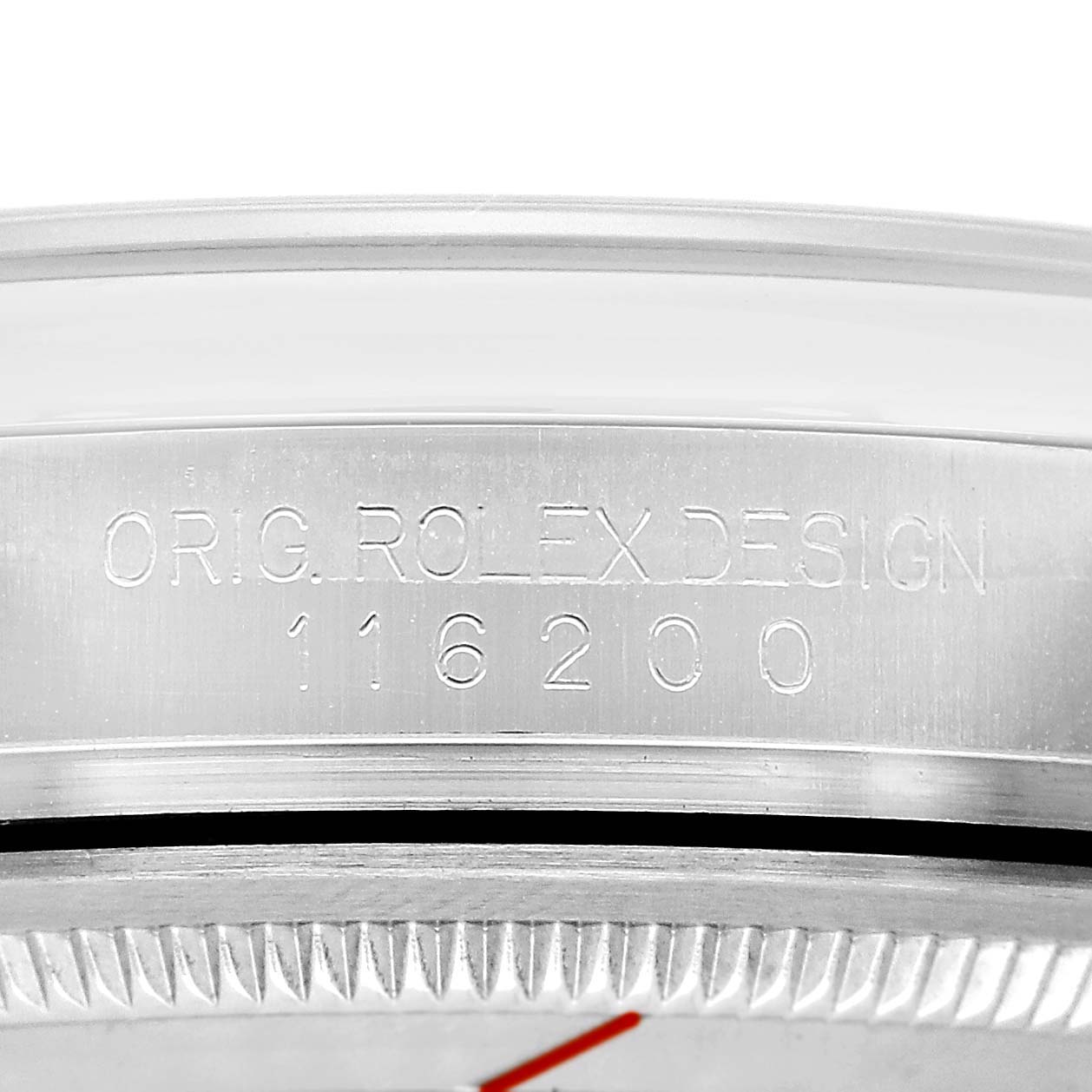 The image shows a close-up of the engraved bezel on a Rolex Datejust 116200 Men's Stainless Steel Silver Dial watch, highlighting the model number.