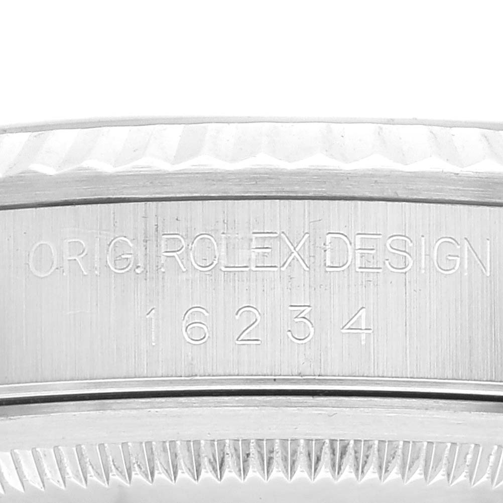 The image shows a close-up of the case side of a Rolex Datejust 16234 Men's Stainless Steel Pink Dial 16234 Men's Stainless Steel Pink Dial watch, with the model number 16234 and the engraved text "ORIG. ROLEX DESIGN."