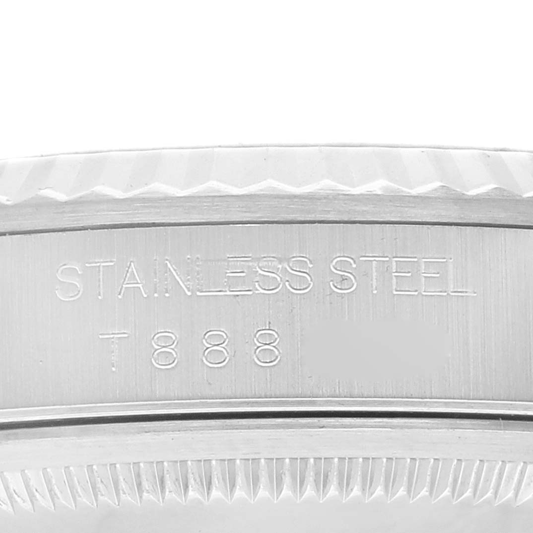 This image shows the side of the stainless steel casing of a Rolex Datejust 16234 Men's Stainless Steel Pink Dial 16234 Men's Stainless Steel Pink Dial watch, featuring engraving details.