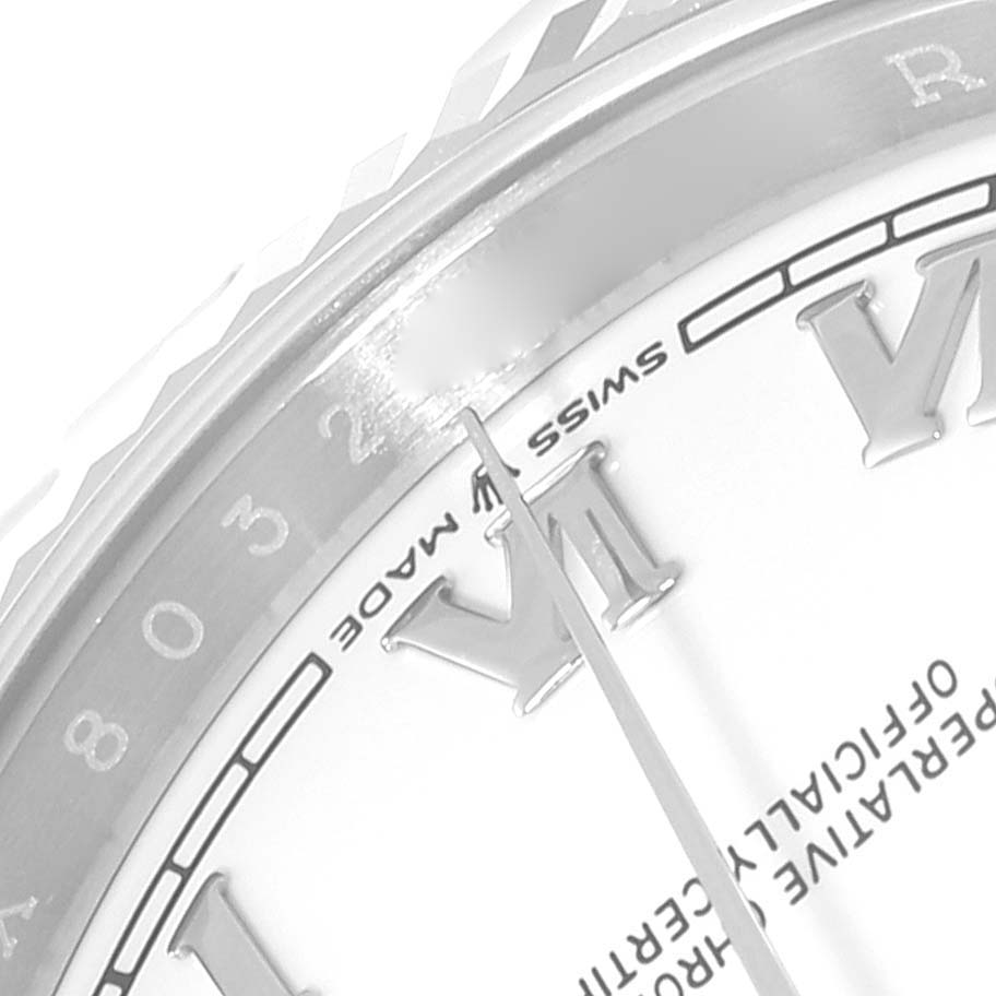 This image shows a close-up of the dial and bezel of a Rolex Datejust 126234 Men's Stainless Steel White Dial 126234 Men's Stainless Steel White Dial watch, focusing on the Roman numeral hour markers and inscription details.