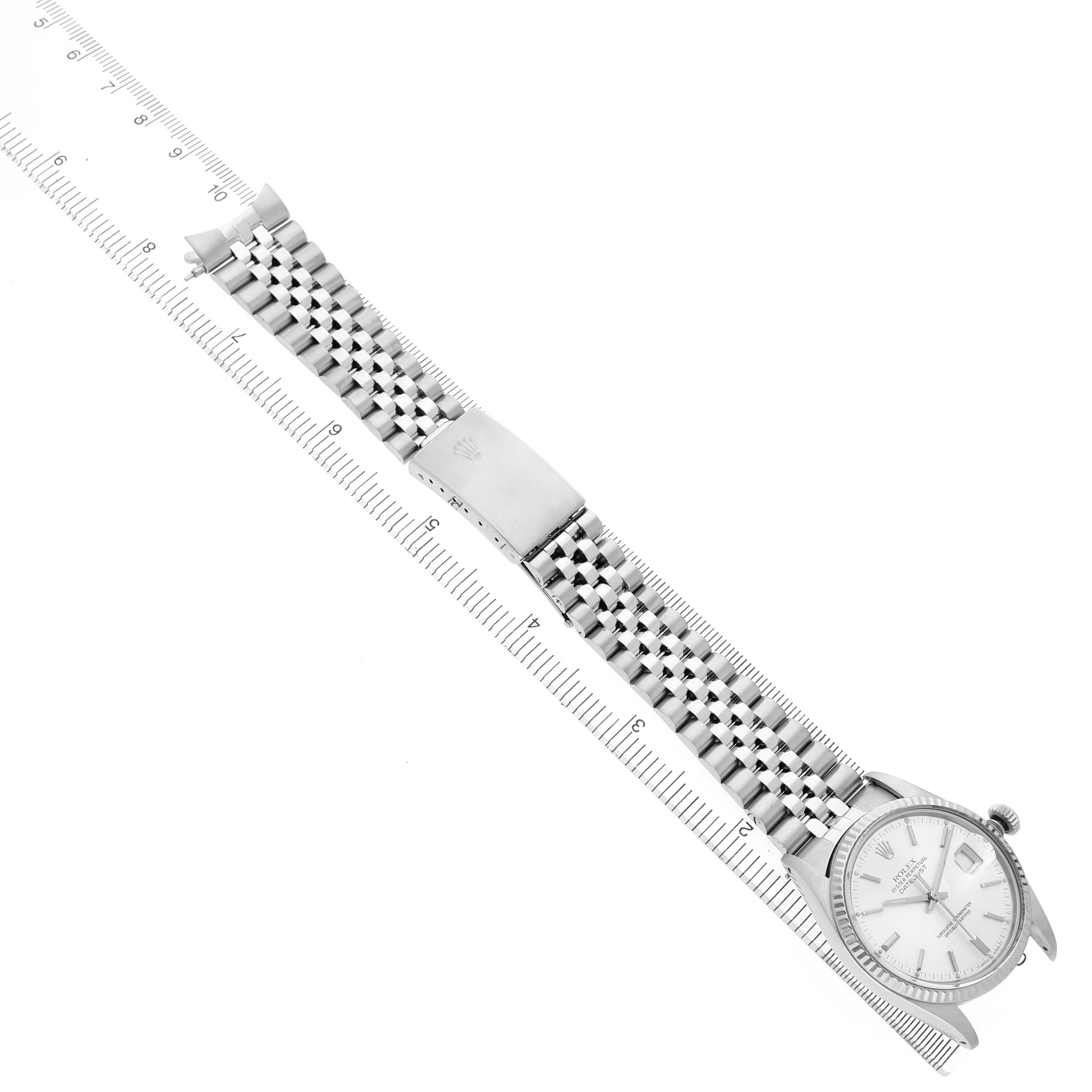The Rolex Vintage Collection 16014 Men's Stainless Steel Silver Dial watch is shown at an angled top view, displaying the face, bracelet, and clasp with a ruler for scale.