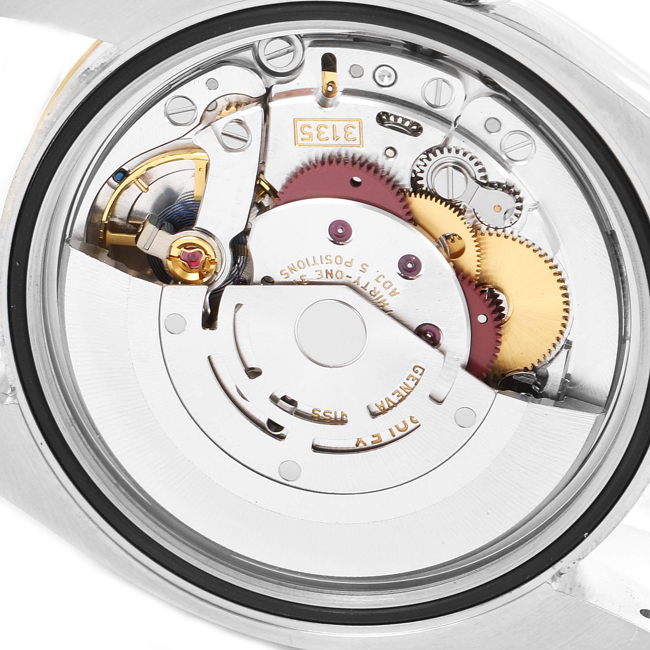 This image shows the intricate movement mechanism of a Rolex Datejust 116233 Men's Steel and Gold (two tone) Champagne Dial 116233 Men's Steel and Gold (two tone) Champagne Dial watch from the back angle.
