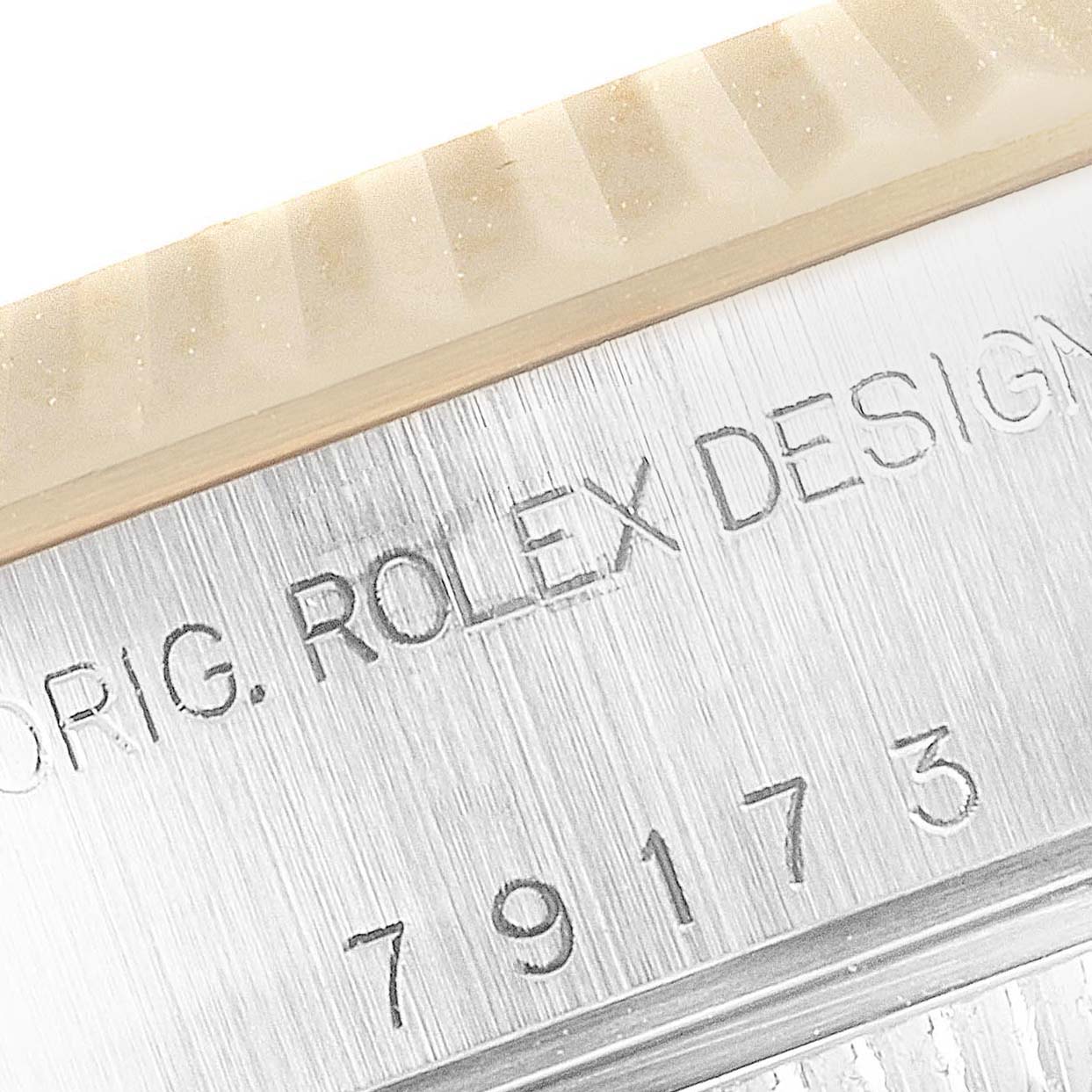 This is a close-up angle of the casing and model number engraving on a Rolex Datejust 79173 Women
s Steel and Gold (two tone) Mother of Pearl Dial 79173 Women
s Steel and Gold (two tone) Mother of Pearl Dial watch.