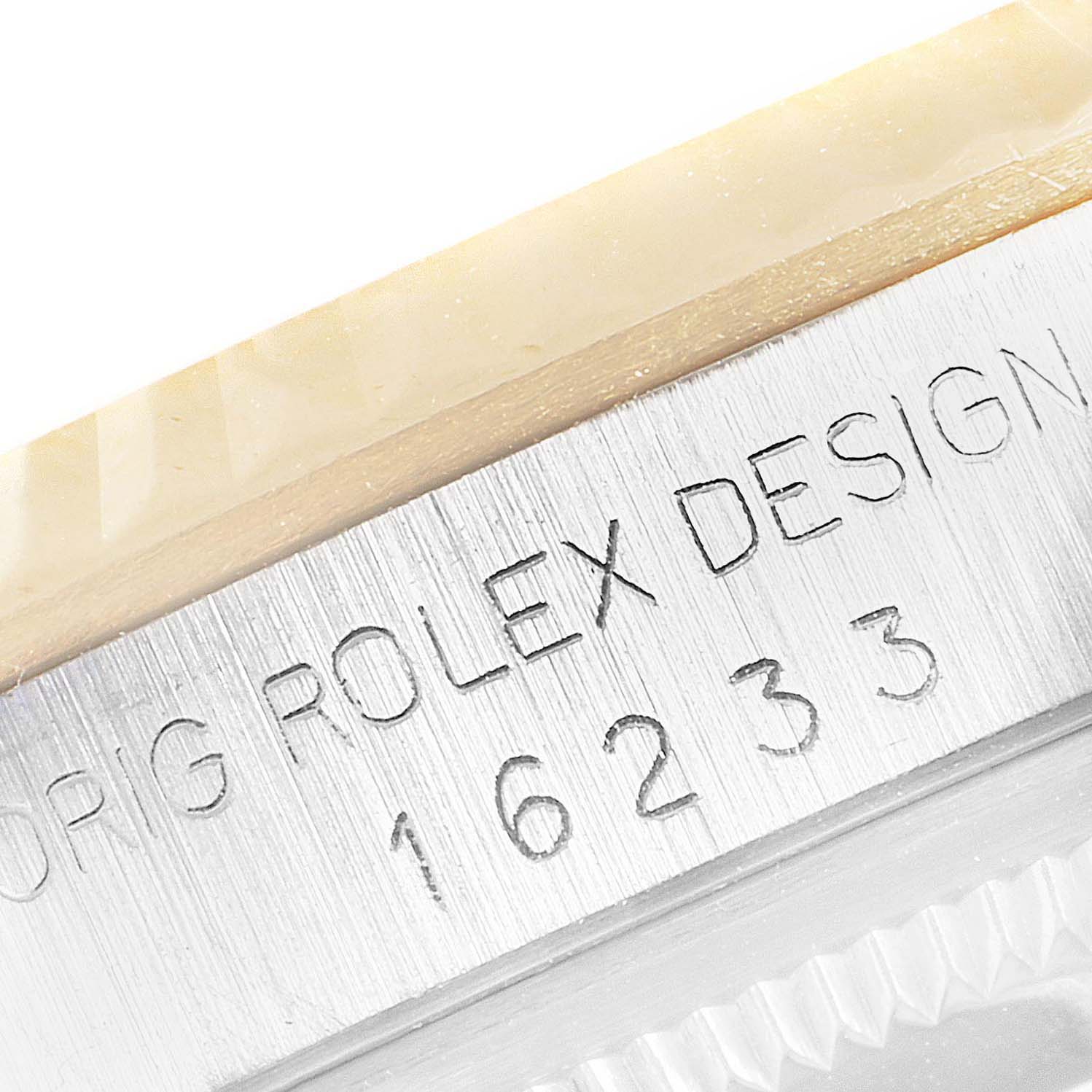 This close-up angle shows the engraved model number "16233" of the Rolex Datejust 16233 Men
s Steel and Gold (two tone) Grey Dial 16233 Men
s Steel and Gold (two tone) Grey Dial on the case.