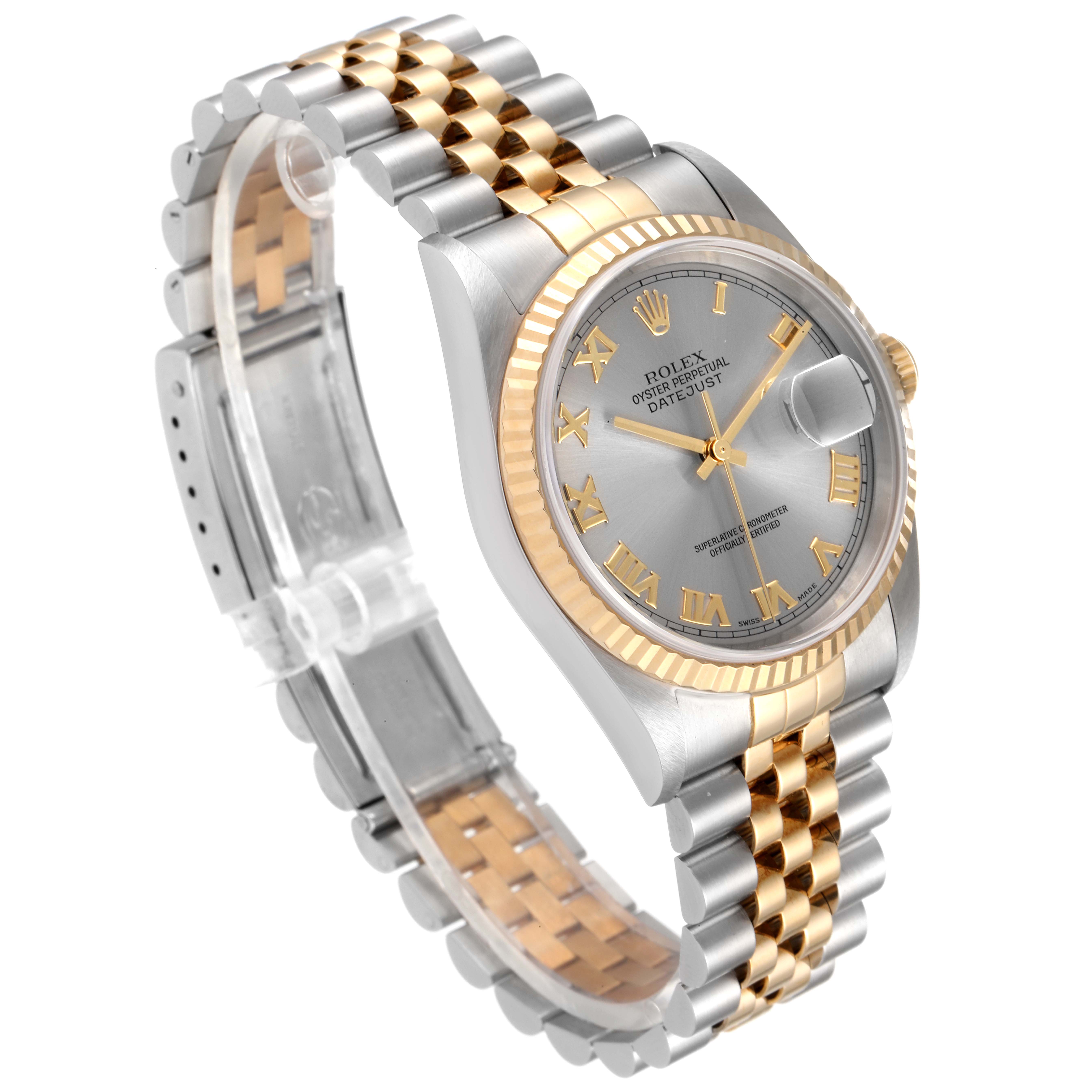 This Rolex Datejust 16233 Men
s Steel and Gold (two tone) Grey Dial 16233 Men
s Steel and Gold (two tone) Grey Dial watch is shown at an angle highlighting the two-tone bracelet, fluted bezel, Roman numeral dial, and date window.