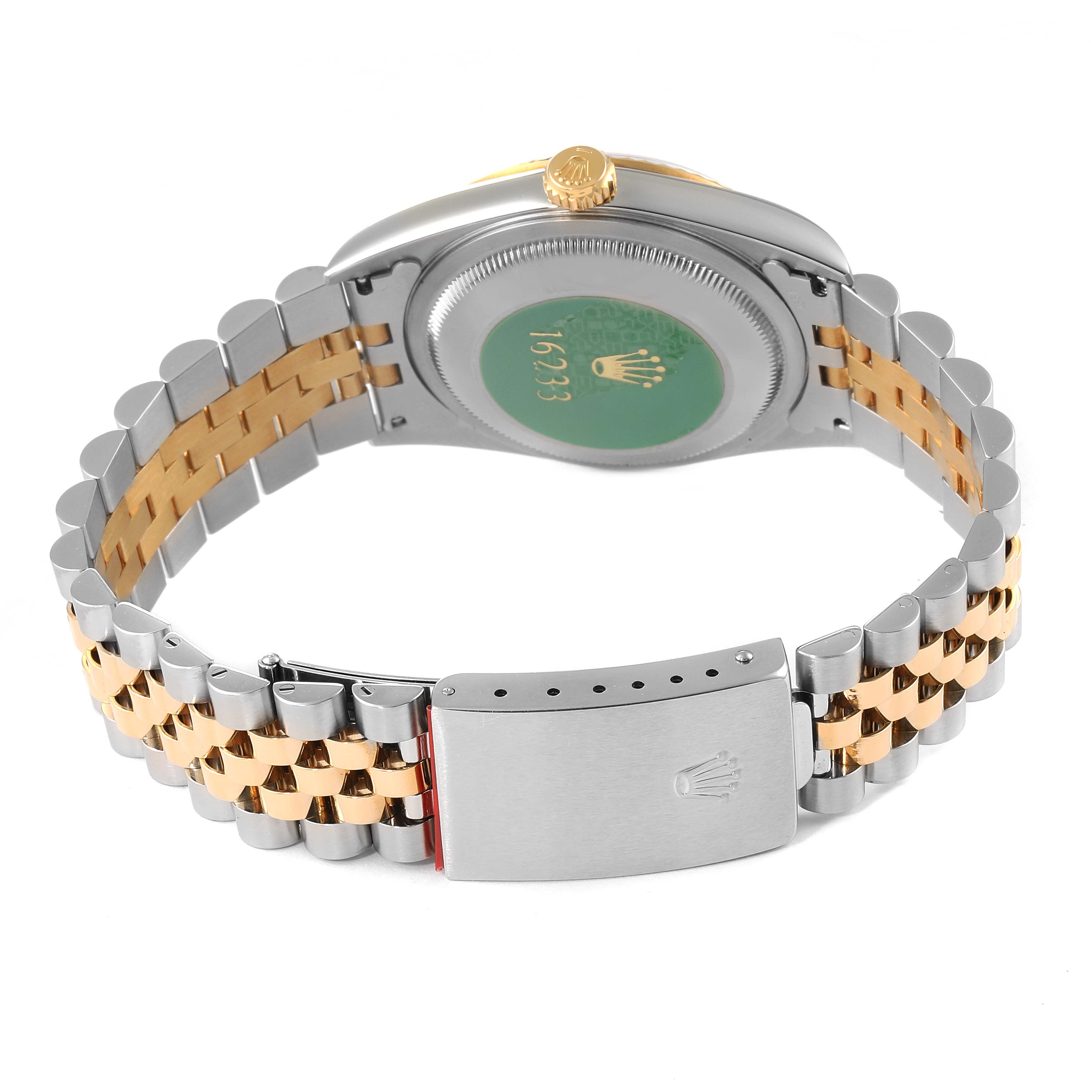 The image shows the back of a Rolex Datejust 16233 Men
s Steel and Gold (two tone) Grey Dial 16233 Men
s Steel and Gold (two tone) Grey Dial watch, focusing on its case back, bracelet, and clasp.