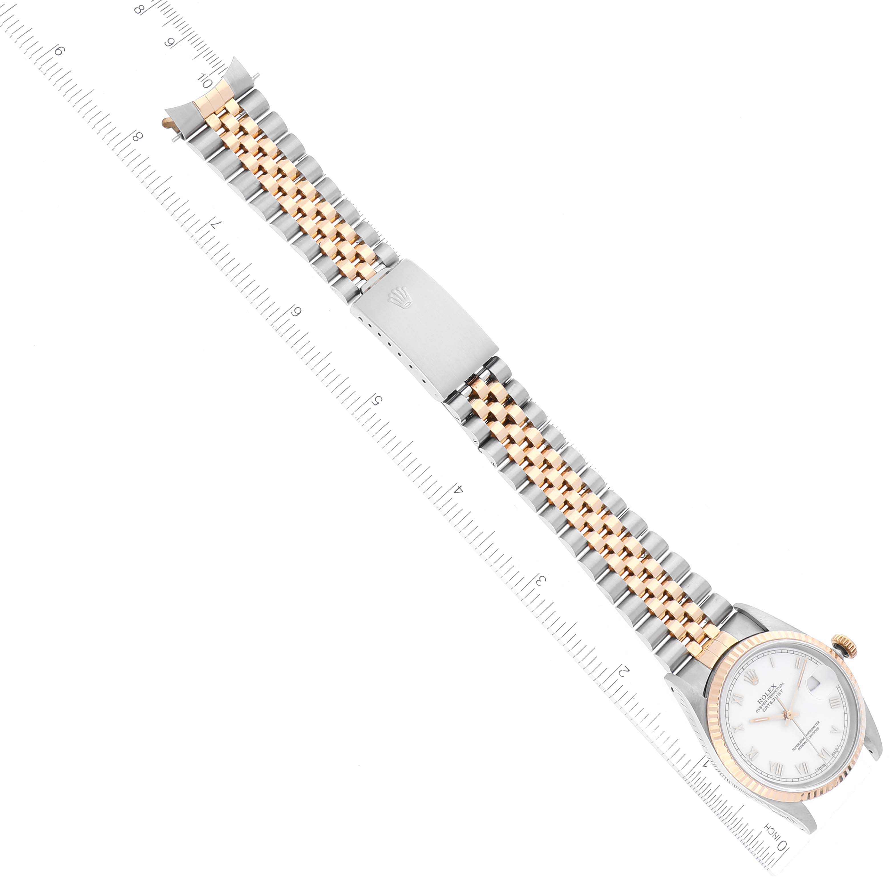 The image shows a Rolex Datejust 16233 Men's Steel and Gold (two tone) White Dial 16233 Men's Steel and Gold (two tone) White Dial watch laid flat with a two-tone bracelet and part of the dial visible.