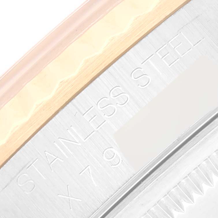 The image shows a close-up of the side of a Rolex Datejust 16233 Men's Steel and Gold (two tone) White Dial 16233 Men's Steel and Gold (two tone) White Dial watch, focusing on the "STAINLESS STEEL" engraving.