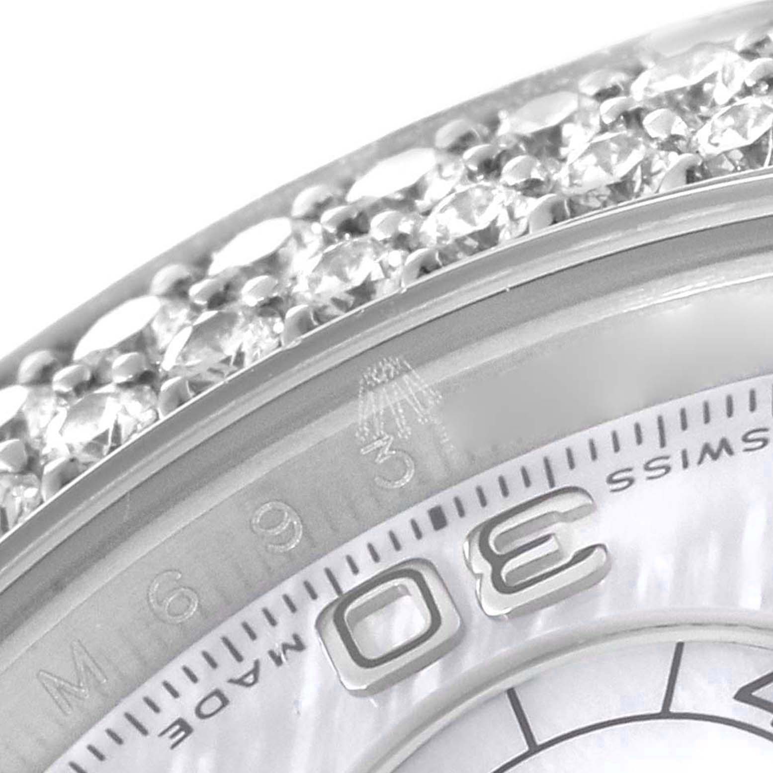 This close-up image of the Rolex Daytona 116589 Men's White Gold Mother of Pearl Dial 116589 Men's White Gold Mother of Pearl Dial watch shows a section of the bezel with diamond detailing and part of the dial with the number 3.