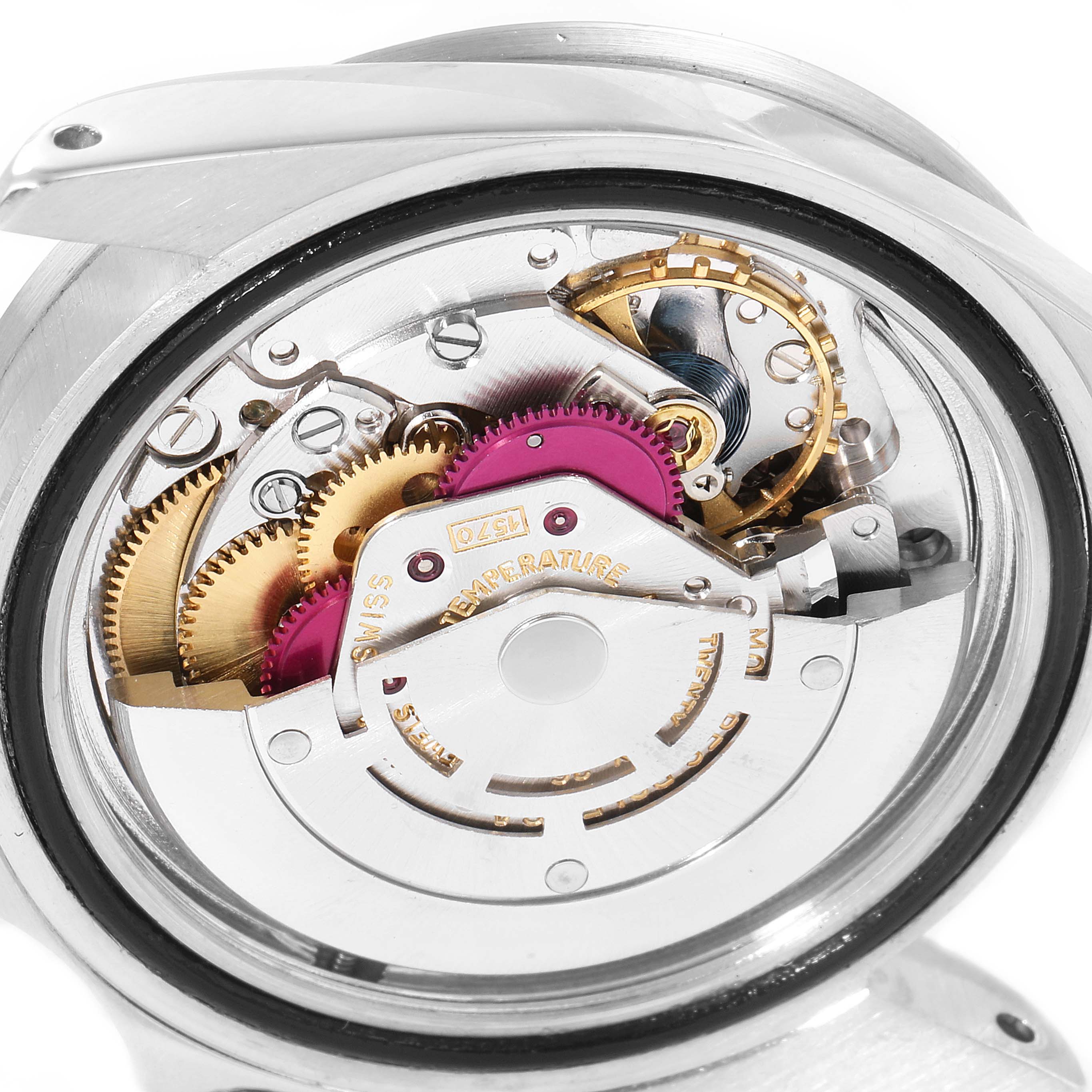 This image shows the internal mechanism of a Vintage Collection model by Rolex, displaying the intricate gears and movement components.