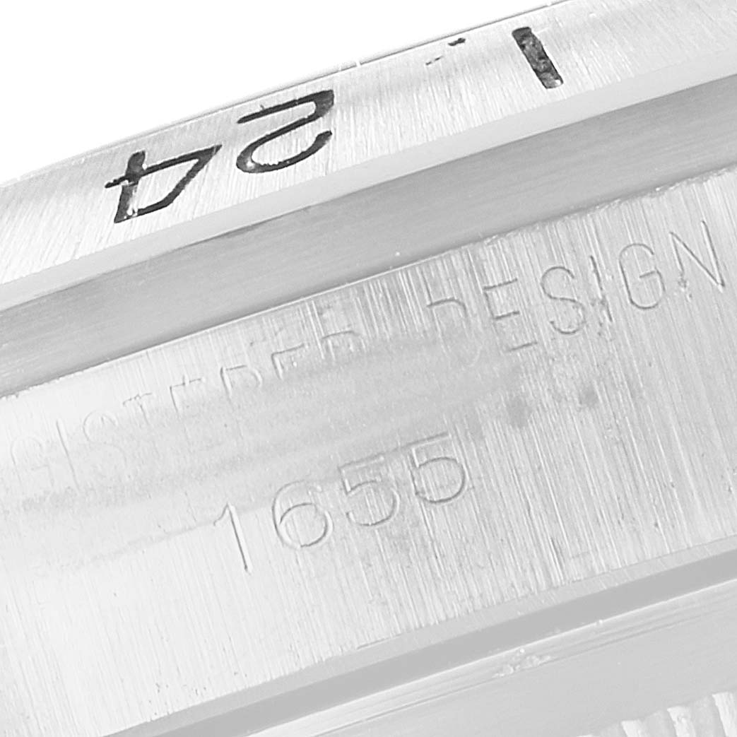 The image shows a close-up of the bezel and the engraved case number "1655" on the Rolex Vintage Collection 1655 Men's Stainless Steel Black Dial 1655 Men's Stainless Steel Black Dial model.