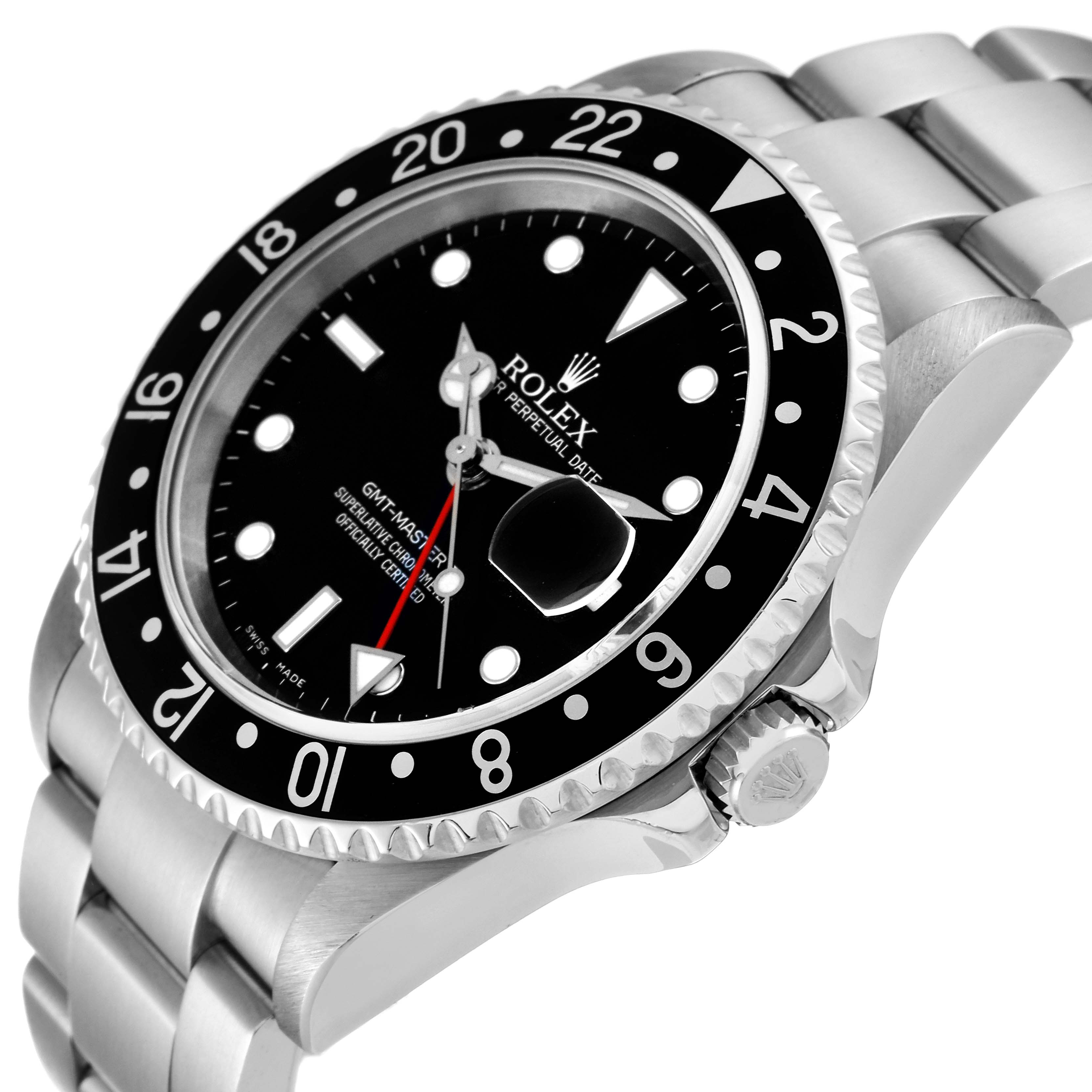 This image shows a Rolex GMT-Master 16710 Men
s Stainless Steel Black Dial 16710 Men
s Stainless Steel Black Dial watch at an angle revealing the face, bezel, crown, and part of the bracelet.