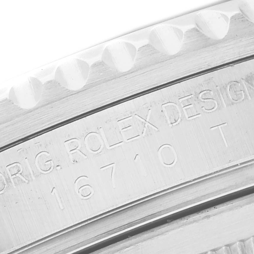 The image shows a close-up view of the engraving on the side of the bezel and case for the Rolex GMT-Master 16710 Men
s Stainless Steel Black Dial 16710 Men
s Stainless Steel Black Dial model.