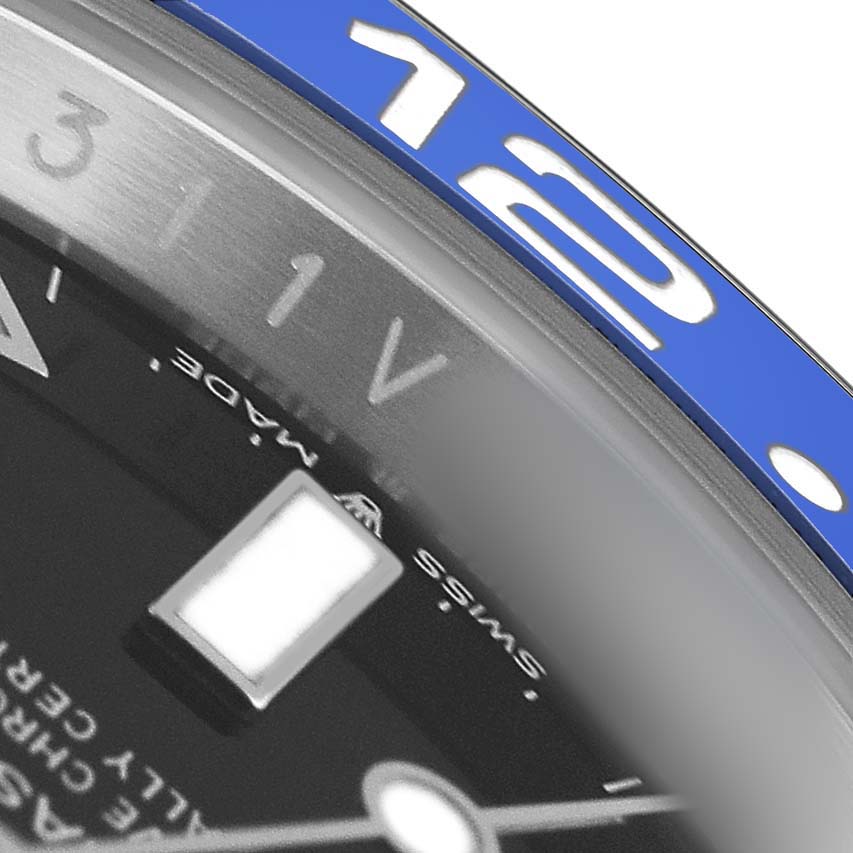 This close-up image of the Rolex GMT-Master M126710BLNR-0003 Men's Stainless Steel Black Dial shows part of the blue bezel and the watch's dial with the "SWISS MADE" label.