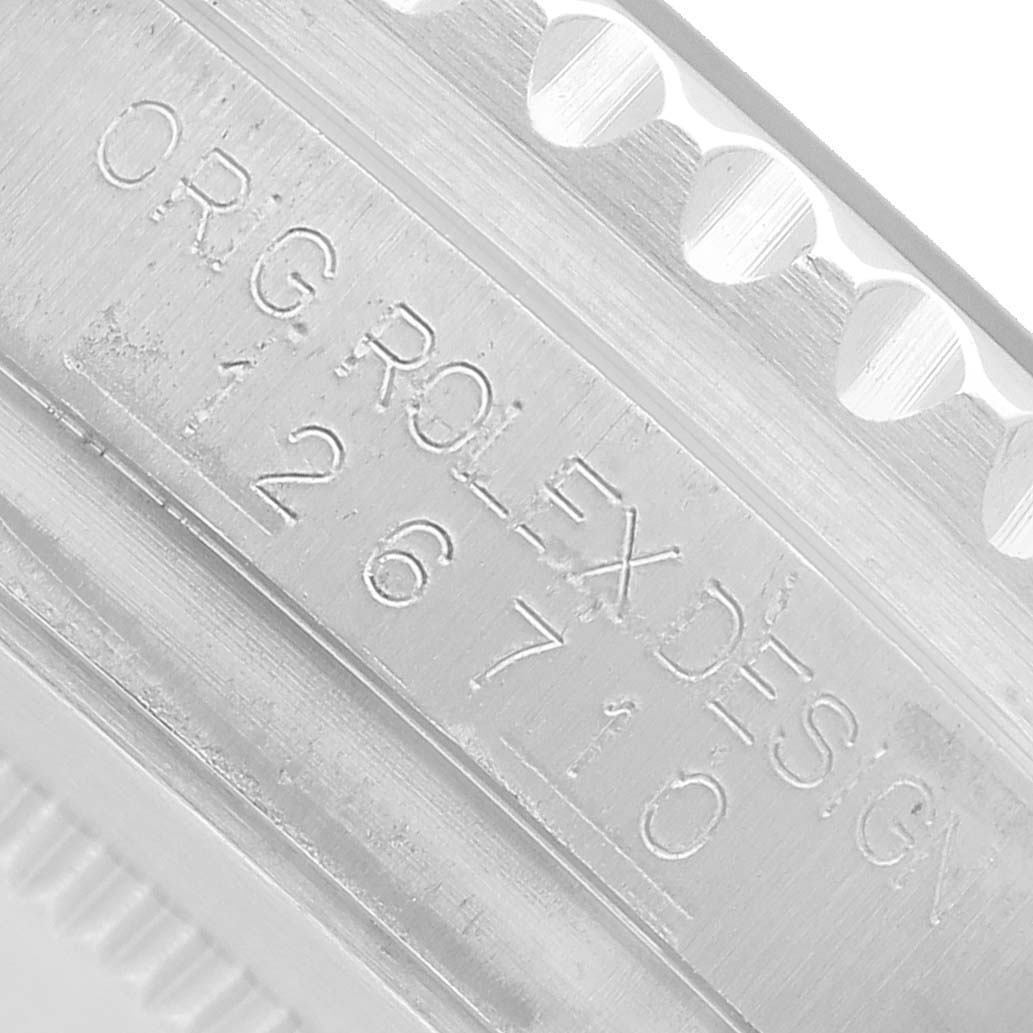 The image shows a close-up of the engraved case side of a Rolex GMT-Master 126710BLRO Men's Stainless Steel Black Dial, highlighting the model number.