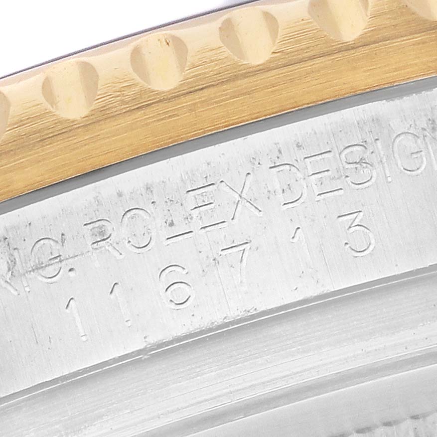 The image shows a close-up of the case side with engravings, focusing on the bezel and model number of a Rolex GMT-Master 116713LN Men's Stainless Steel Black Dial.
