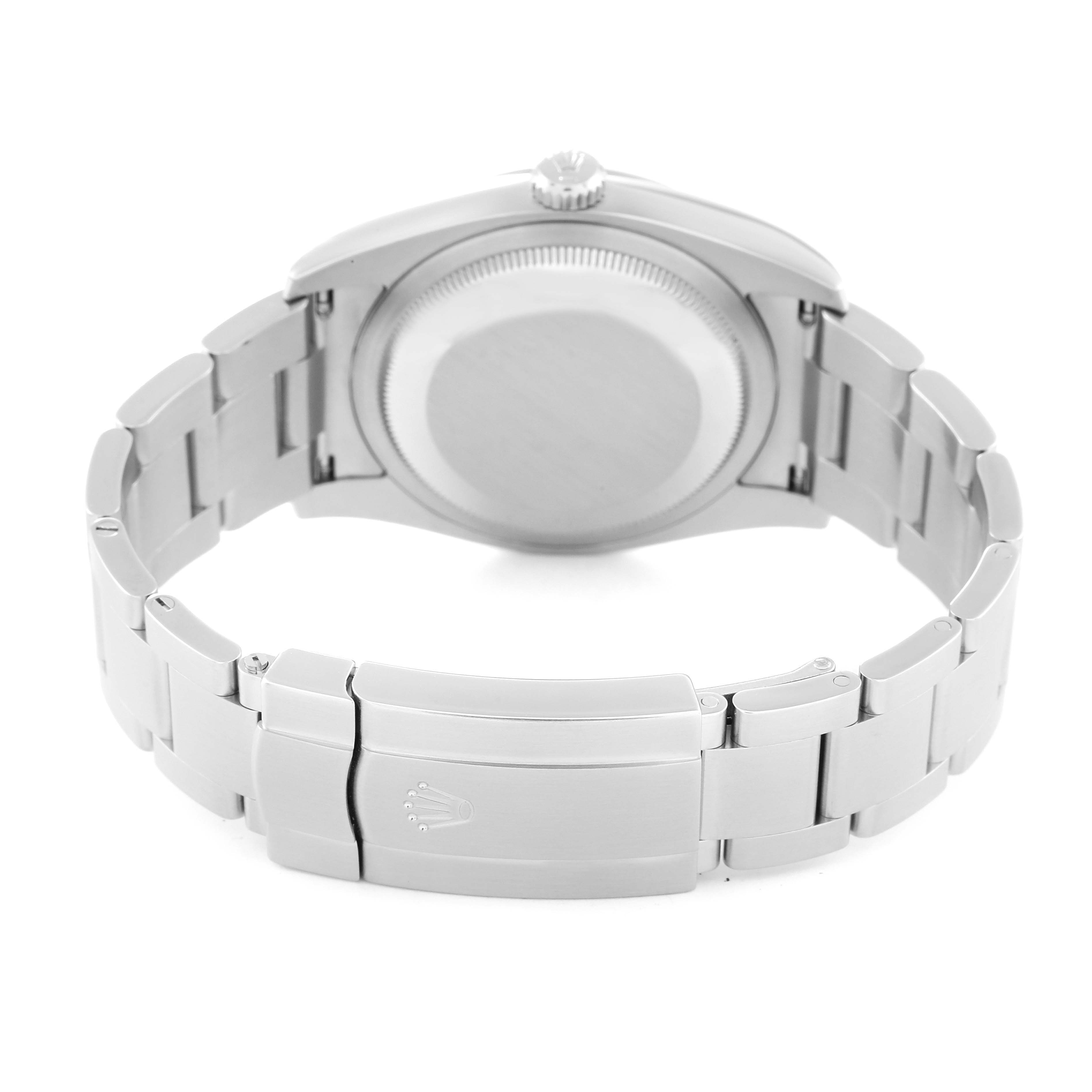 This Rolex Oyster Perpetual 116000 Men's Stainless Steel Black Dial 116000 Men's Stainless Steel Black Dial watch is shown from the back, highlighting its case back, bracelet, and clasp.