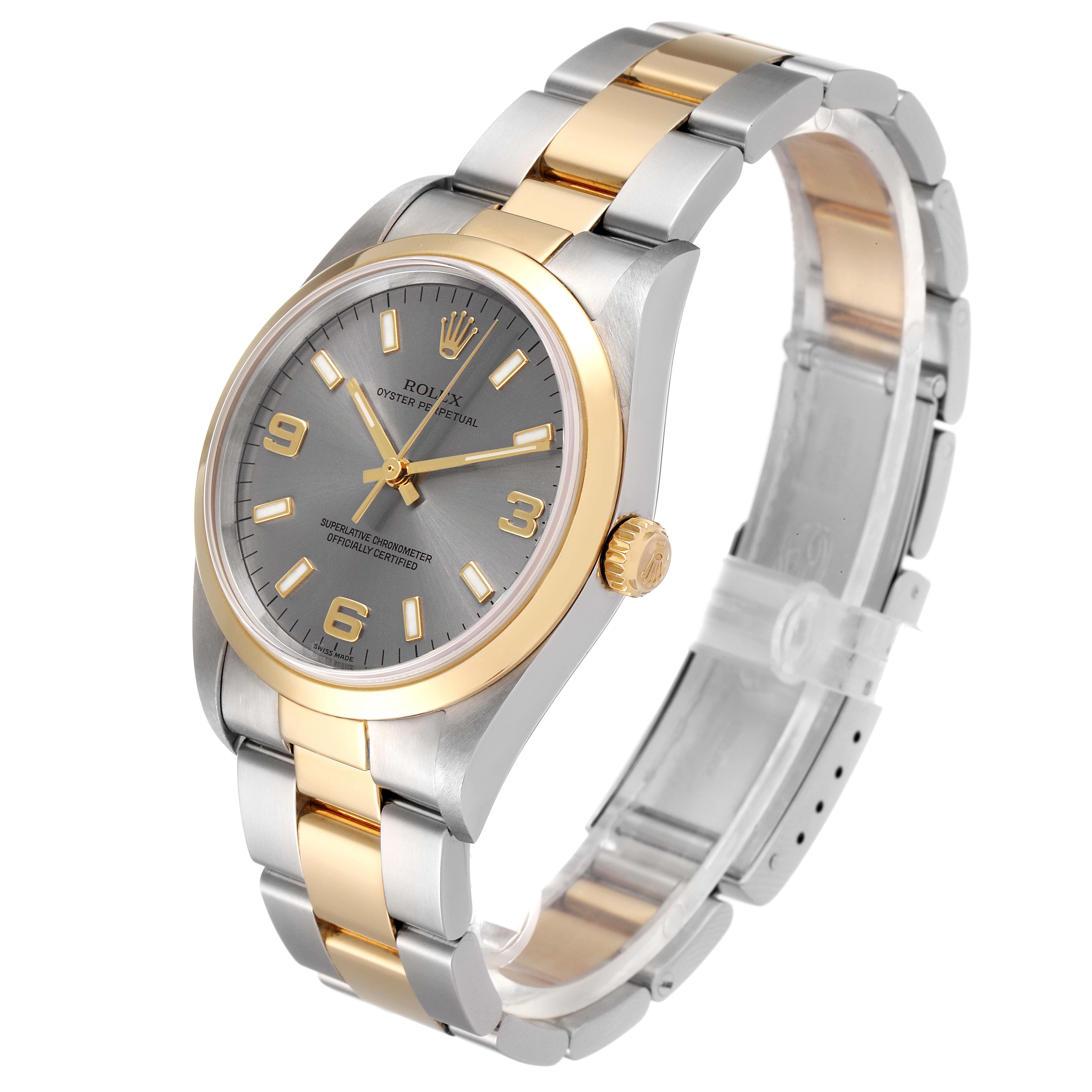 The Rolex Oyster Perpetual 14203 Men's Steel and Gold (two tone) Grey Dial 14203 Men's Steel and Gold (two tone) Grey Dial is shown from a three-quarter angle, highlighting the face, crown, and two-tone bracelet.
