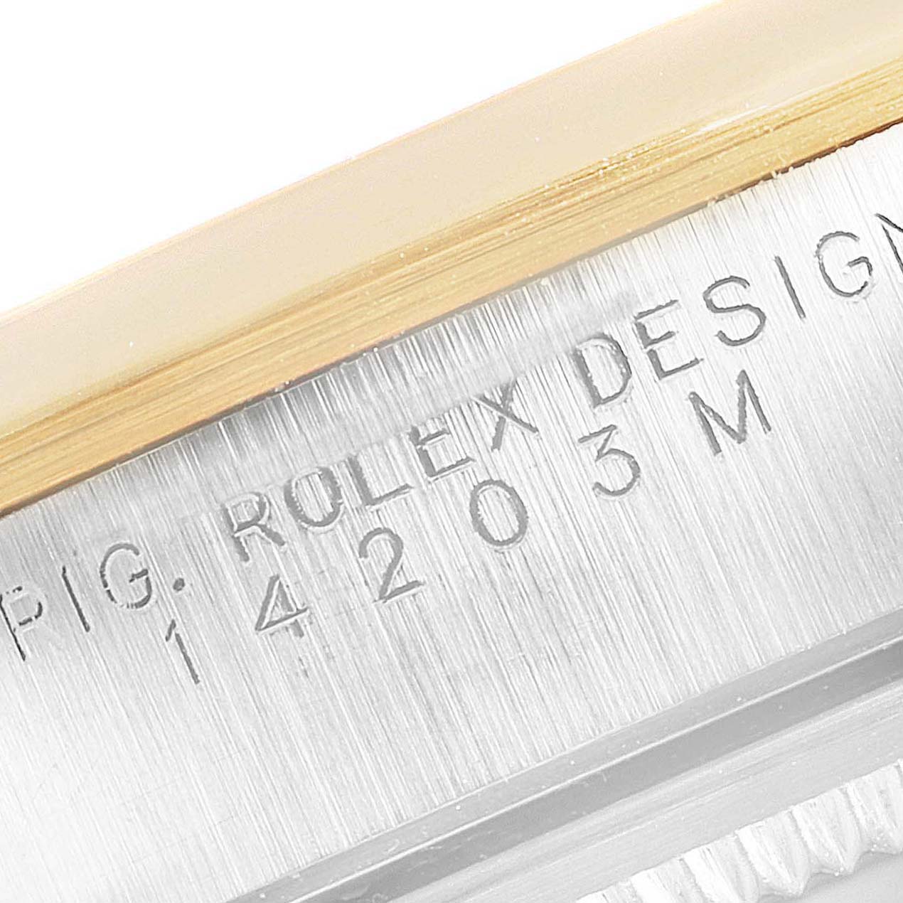 The image shows a close-up of the casing side of a Rolex Oyster Perpetual 14203 Men's Steel and Gold (two tone) Grey Dial 14203 Men's Steel and Gold (two tone) Grey Dial watch, highlighting its engraved model information.