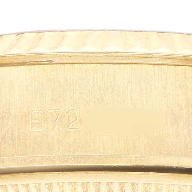 The image shows a close-up of the case side of a Rolex President 69178 Women's Yellow Gold Champagne Dial watch, featuring engraved markings.