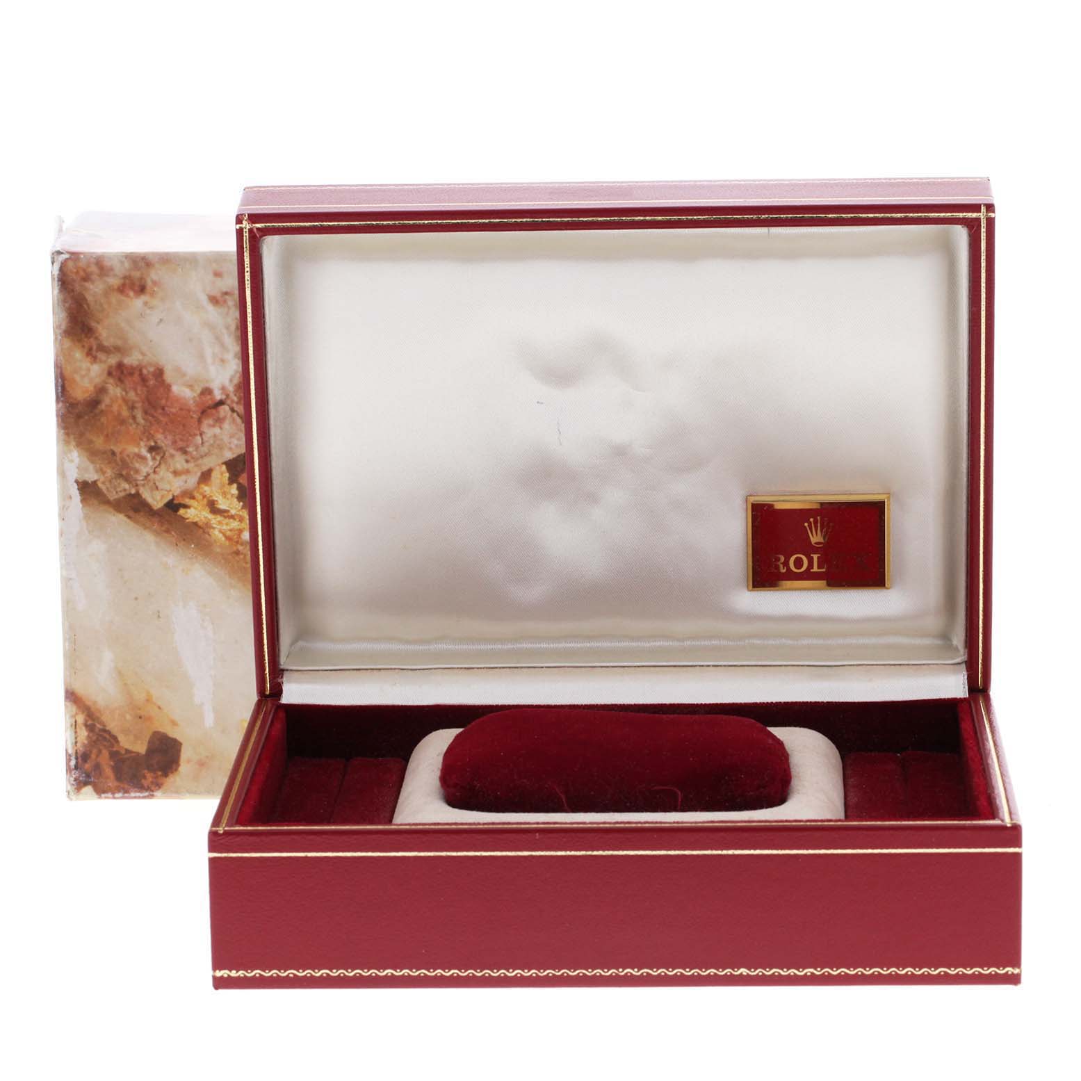 This image shows an open red watch box for a Rolex President 68278 Women's Yellow Gold Champagne Dial 68278 Women's Yellow Gold Champagne Dial model, revealing a cushioned interior for the watch.