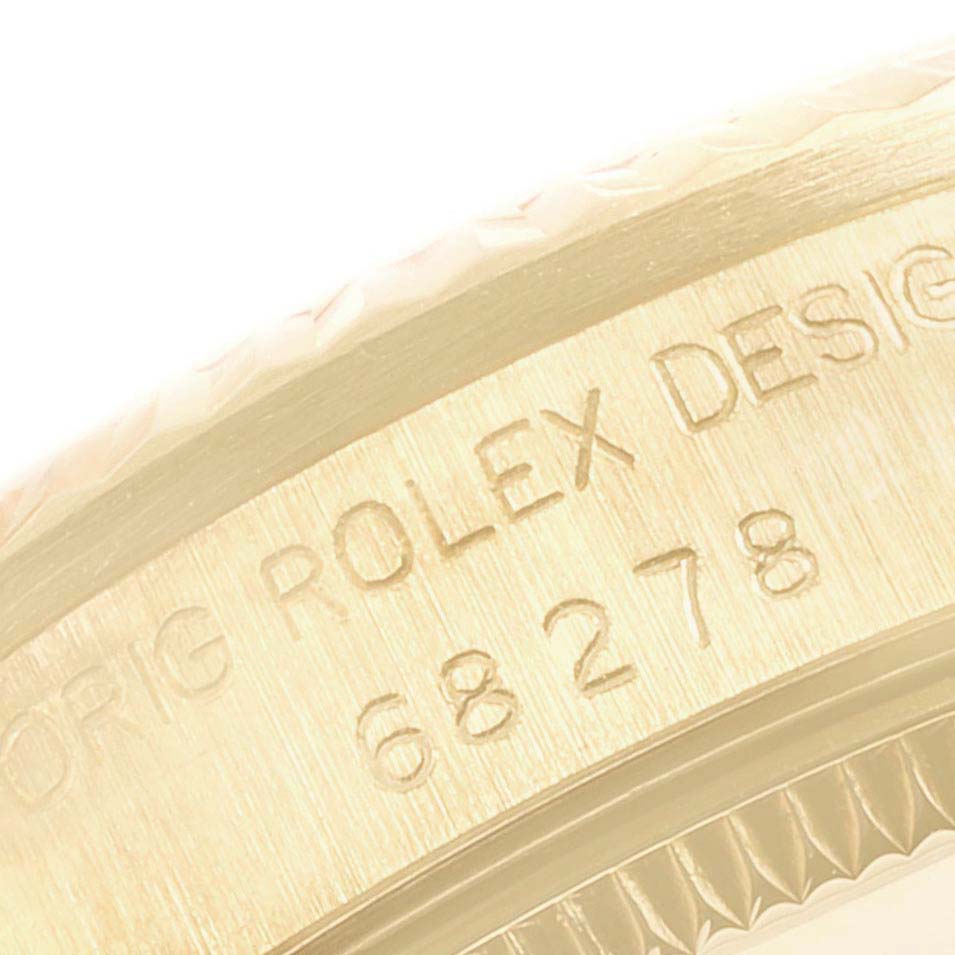 This image shows a close-up of the case side and engraved serial number of a Rolex President 68278 Women's Yellow Gold Champagne Dial 68278 Women's Yellow Gold Champagne Dial model watch.
