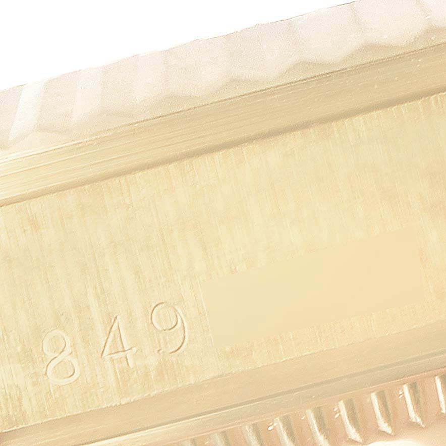 The image shows a close-up of the serial number engraved on the side of a Rolex President 68278 Women's Yellow Gold Champagne Dial 68278 Women's Yellow Gold Champagne Dial model watch.