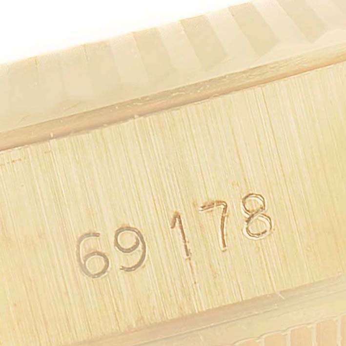 This image shows a close-up of the case-side from a Rolex President 69178 Women
s Yellow Gold Champagne Dial 69178 Women
s Yellow Gold Champagne Dial model, indicating the model number 69178.