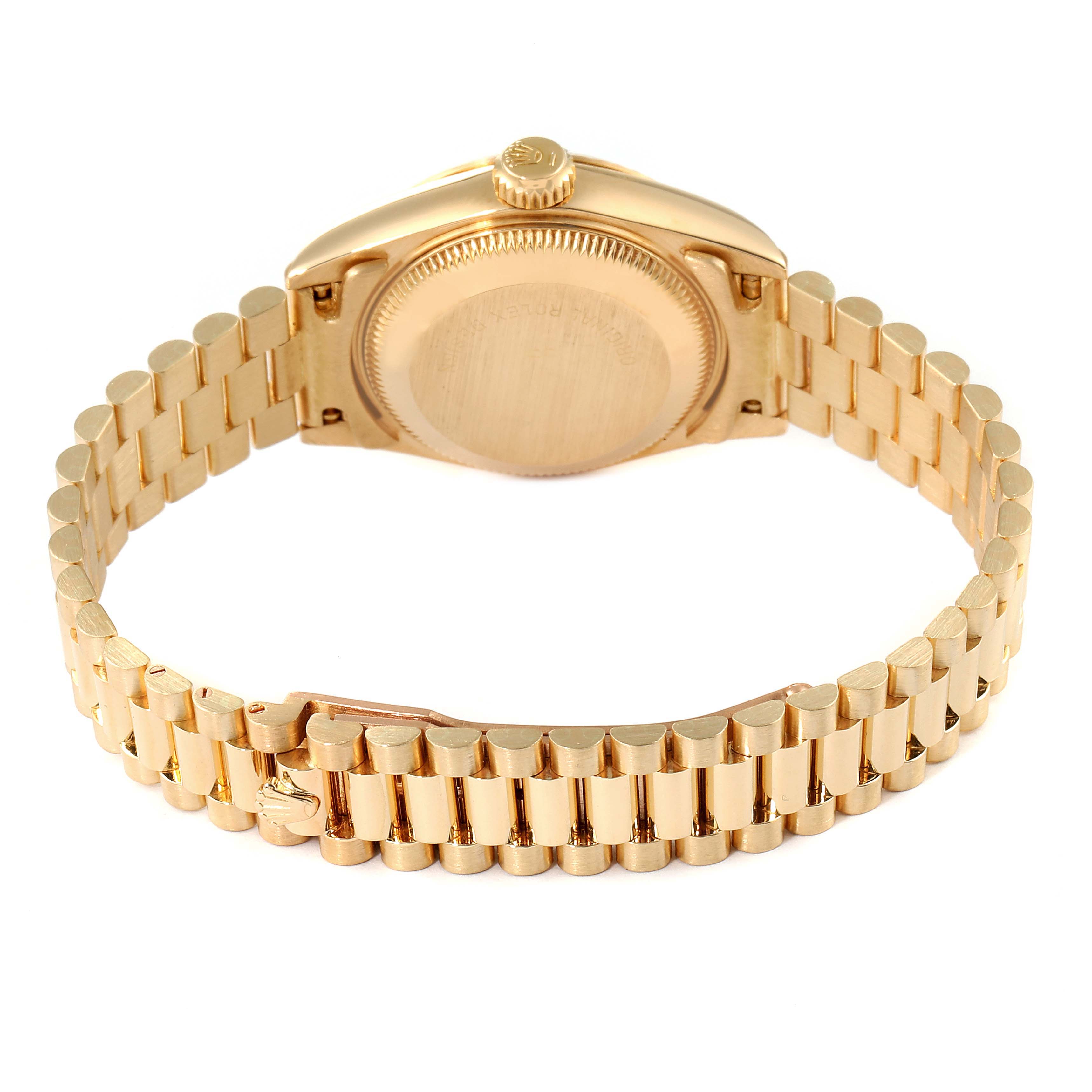 The image shows the back case and bracelet of a Rolex President 69178 Women
s Yellow Gold Champagne Dial 69178 Women
s Yellow Gold Champagne Dial model watch from a rear angle.