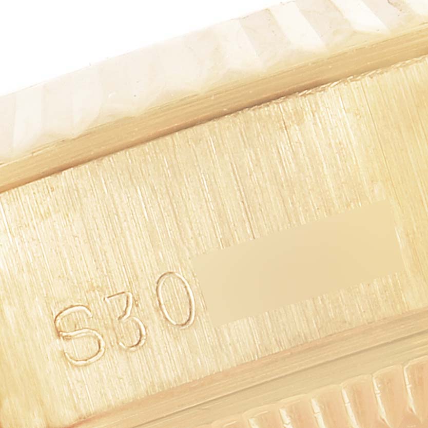 The image shows a close-up view of the serial number engraved on the side of a Rolex President 69178 Women
s Yellow Gold Champagne Dial 69178 Women
s Yellow Gold Champagne Dial model watch.