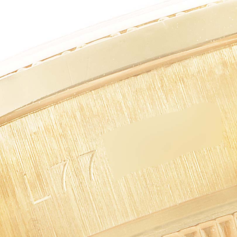This close-up image shows the edge and part of the inner case of a Rolex President 69158 Women
s Yellow Gold Champagne Dial 69158 Women
s Yellow Gold Champagne Dial model watch.