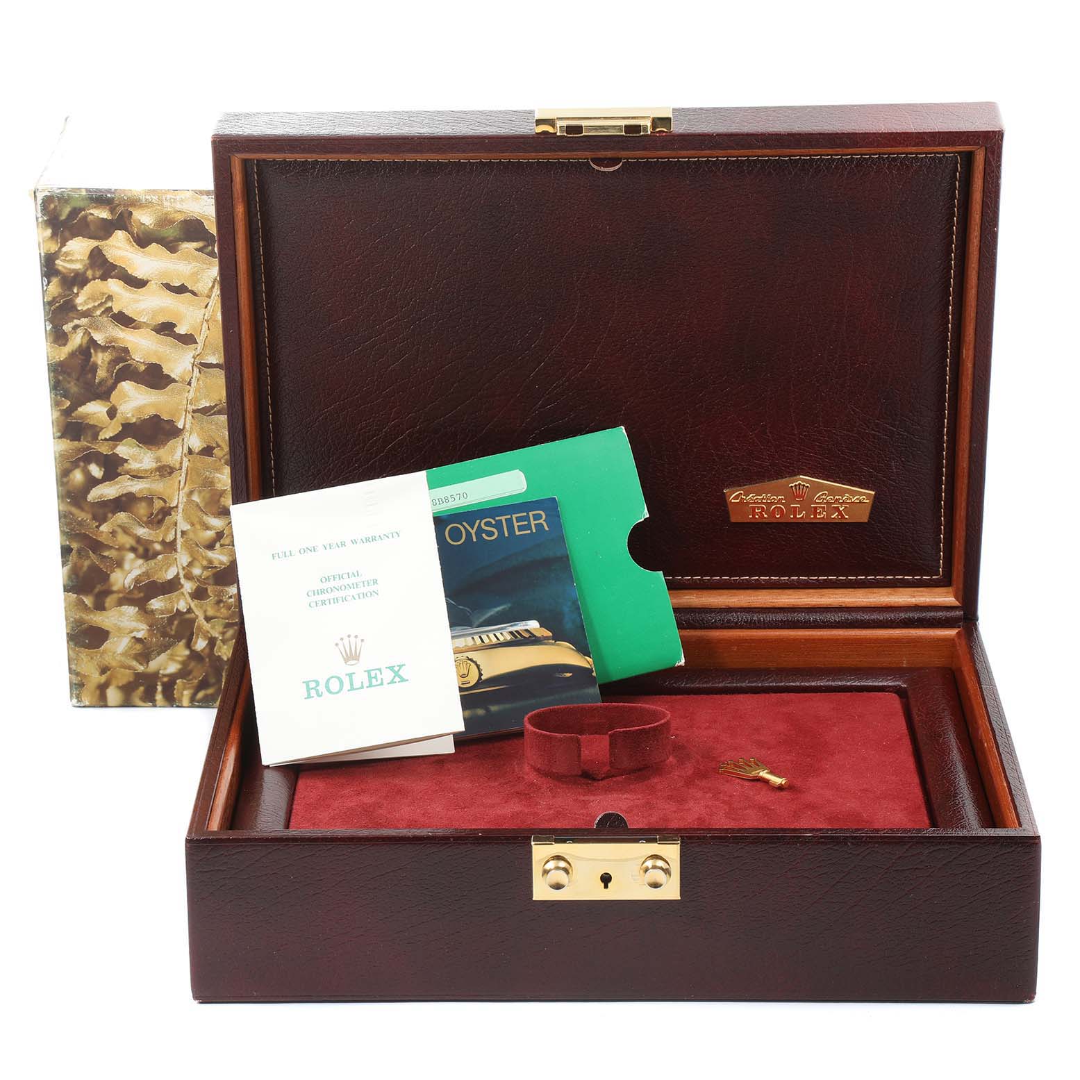 The image shows the open box of a Rolex President 69158 Women
s Yellow Gold Champagne Dial 69158 Women
s Yellow Gold Champagne Dial model watch, along with its booklet and accessories.